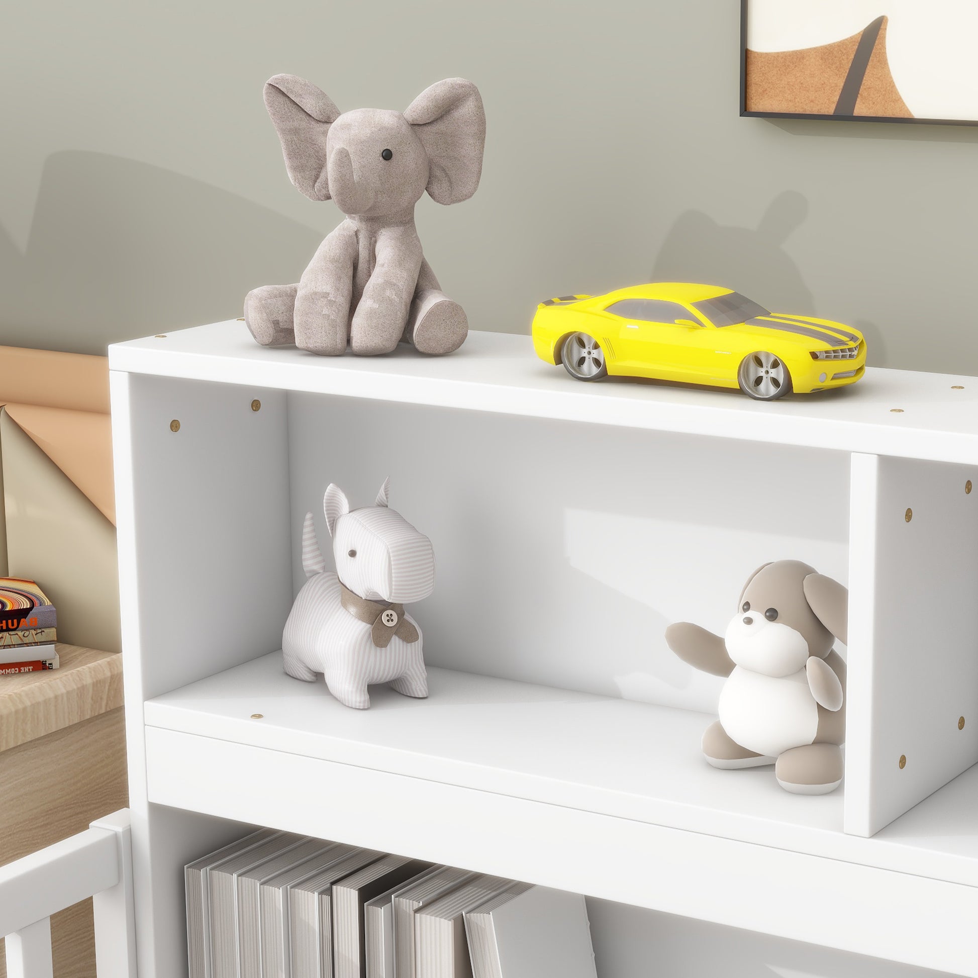 Plush grey elephant toy sitting on a white shelf