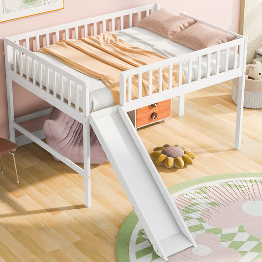 White wooden loft bed with slide featuring a cozy mattress pillows and an orange drawer unit underneath