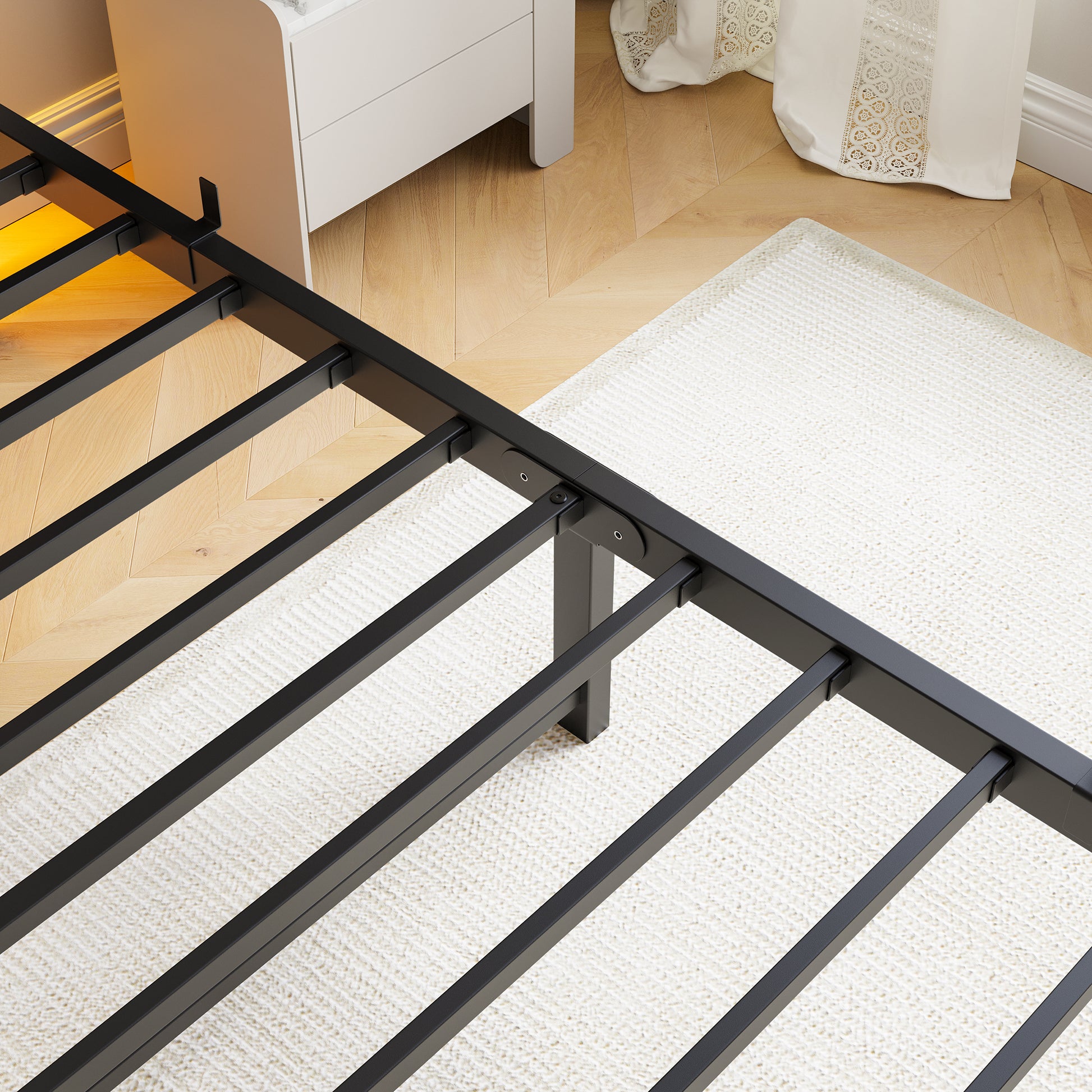 Black metal bed frame with sturdy support slats