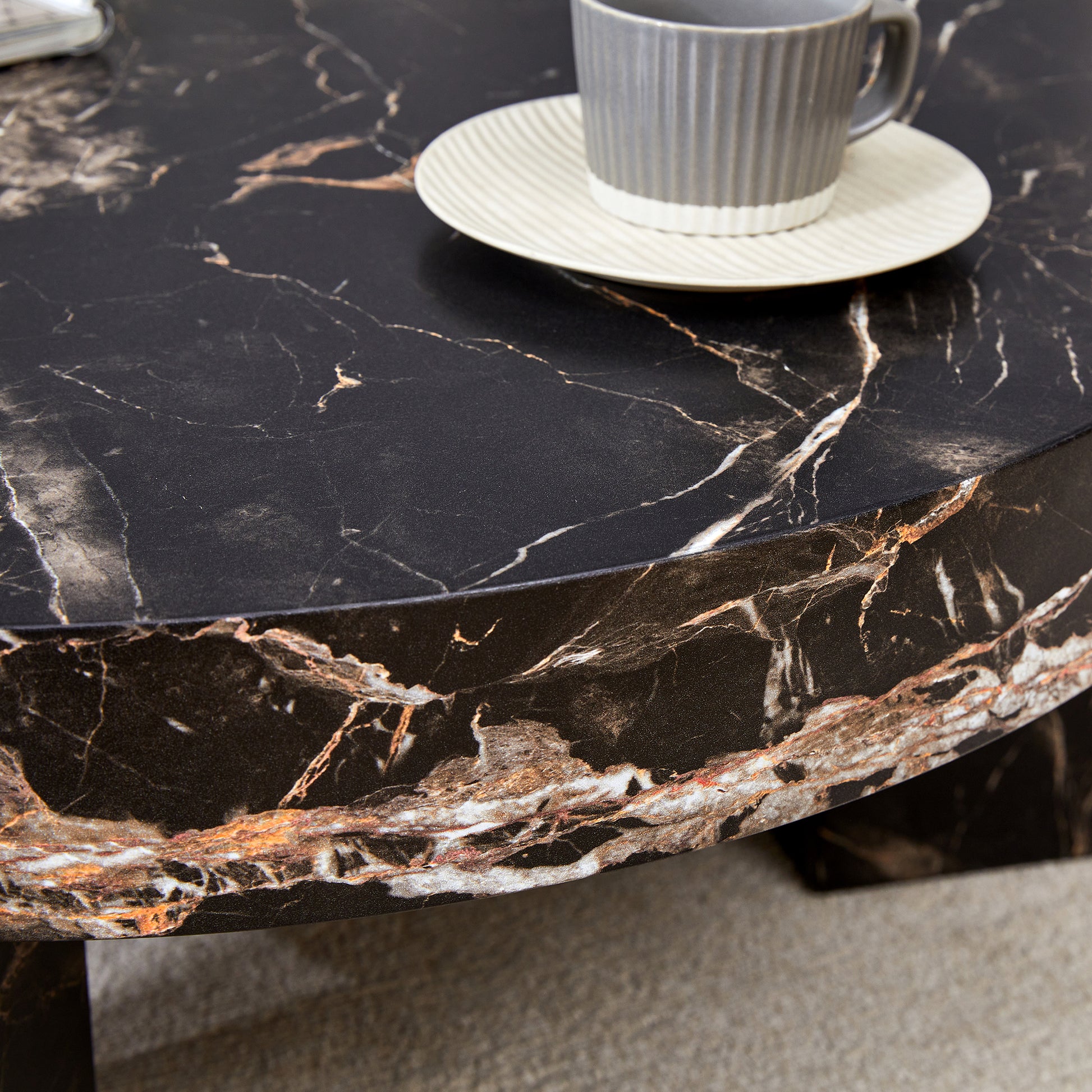 Dark marble coffee table with gold veining perfect for modern living rooms