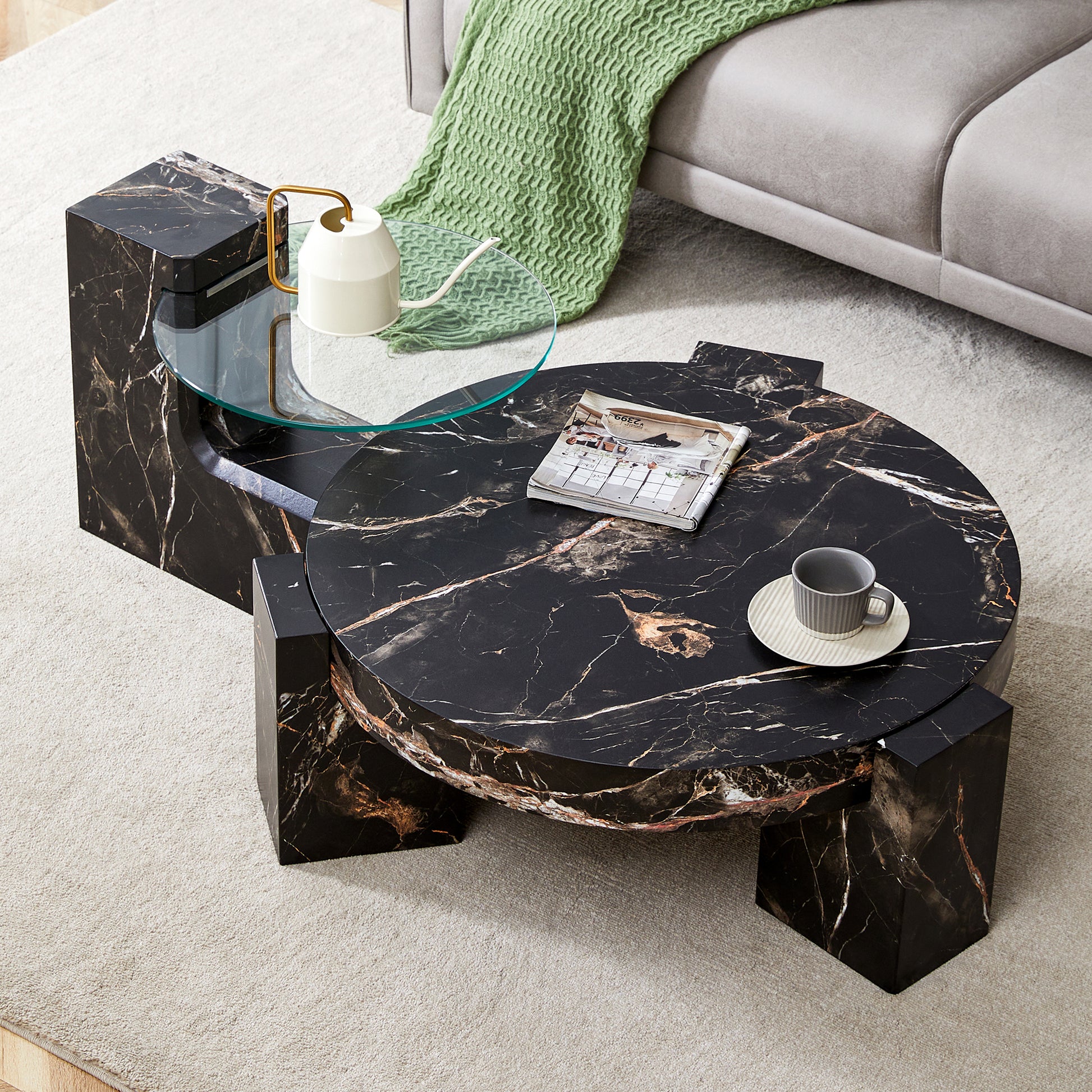 Black marble coffee table with a round top and angular base