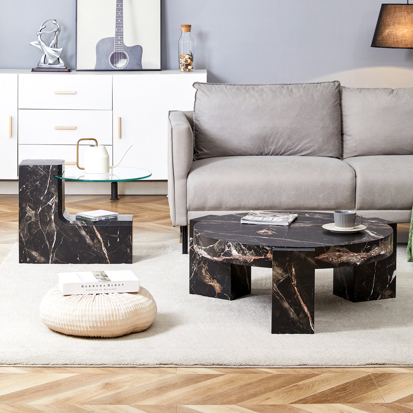 Black marble coffee table with striking gold veining and a modern angular design