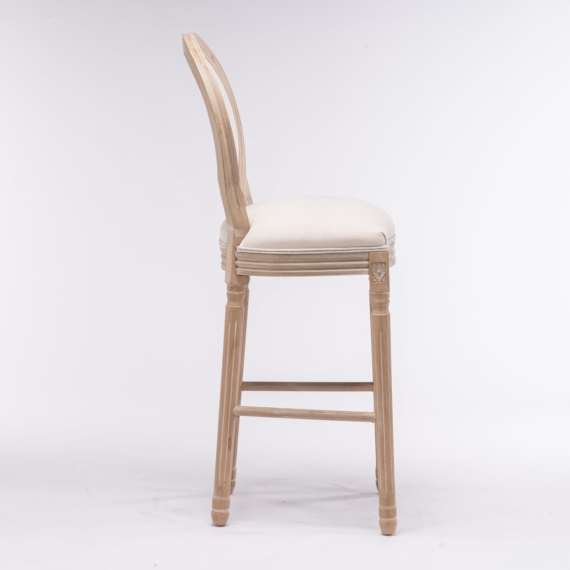 Light wood carved accent bar stool with cream fabric seat