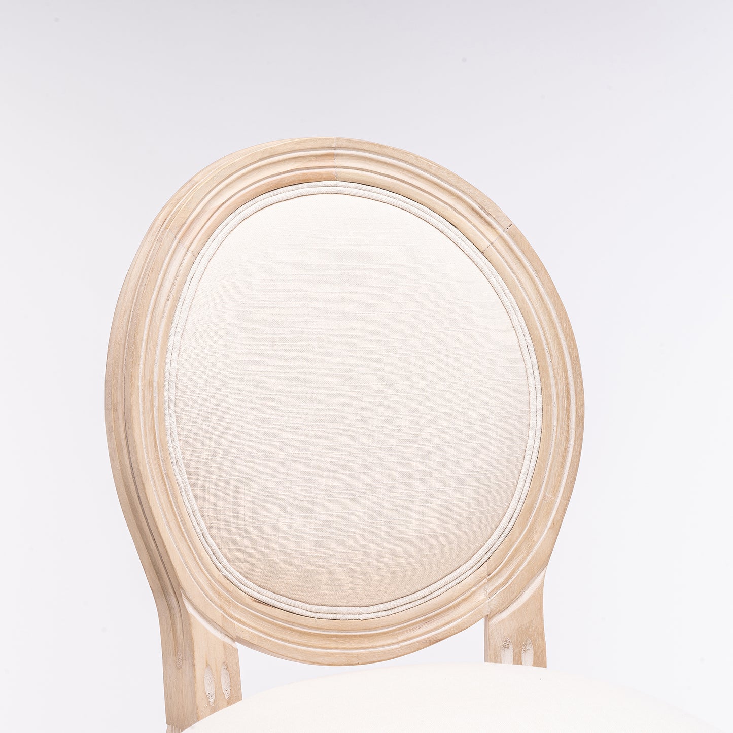 Antique wood dining chair with oval upholstered backrest in cream fabric