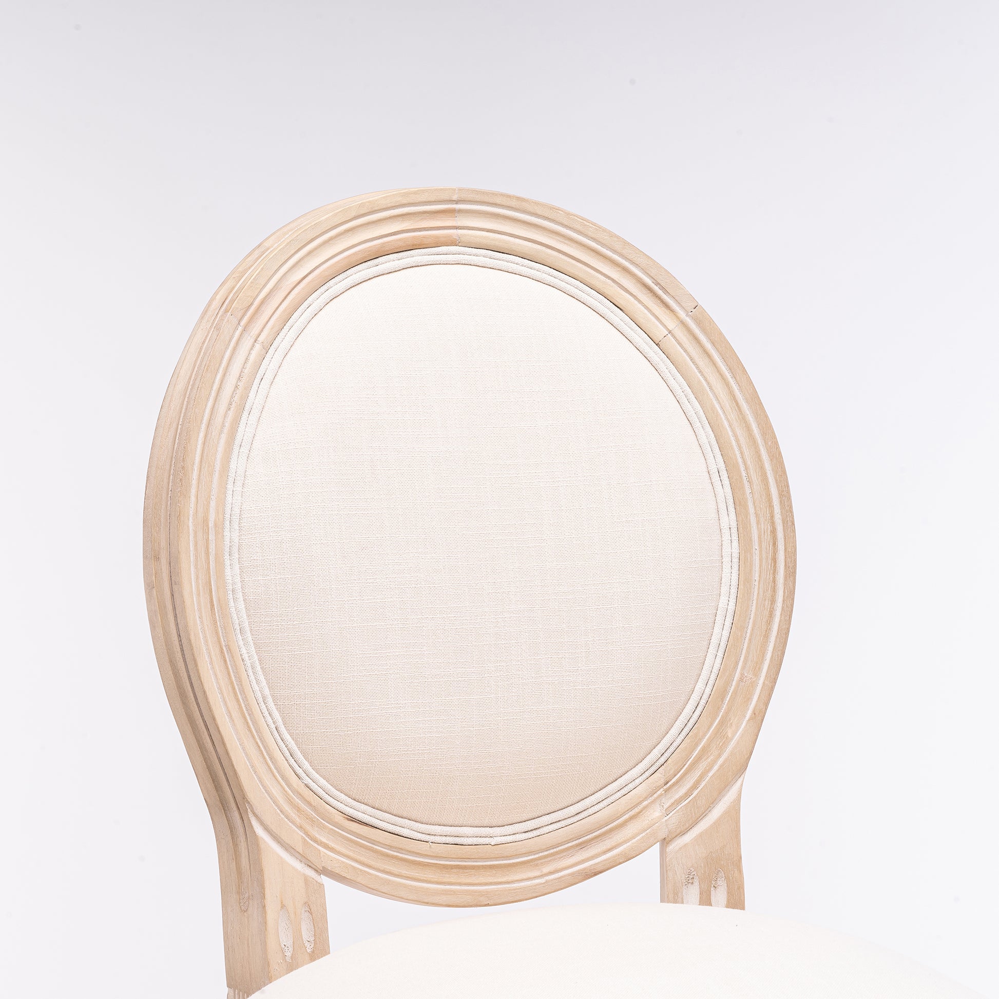 Antique wood dining chair with oval upholstered backrest in cream fabric
