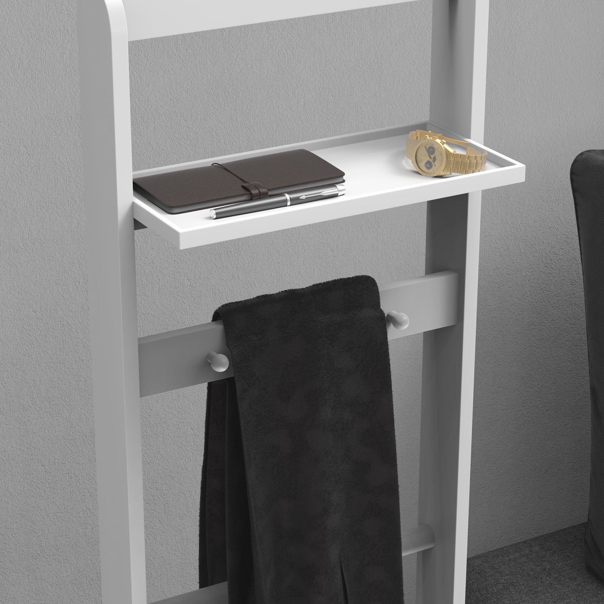 White entryway organizer shelf with gold watch and notebook