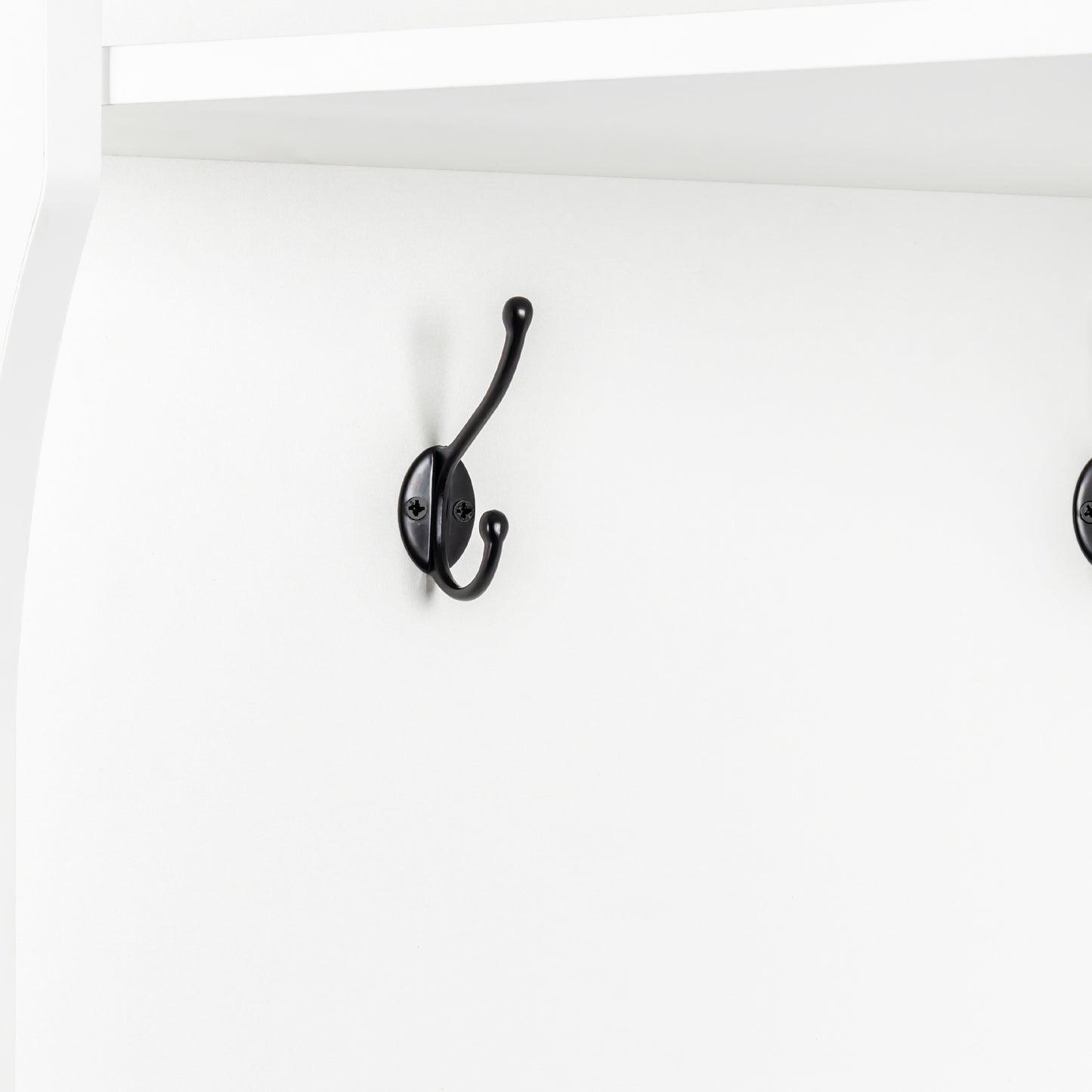 Black double coat hook on white wall