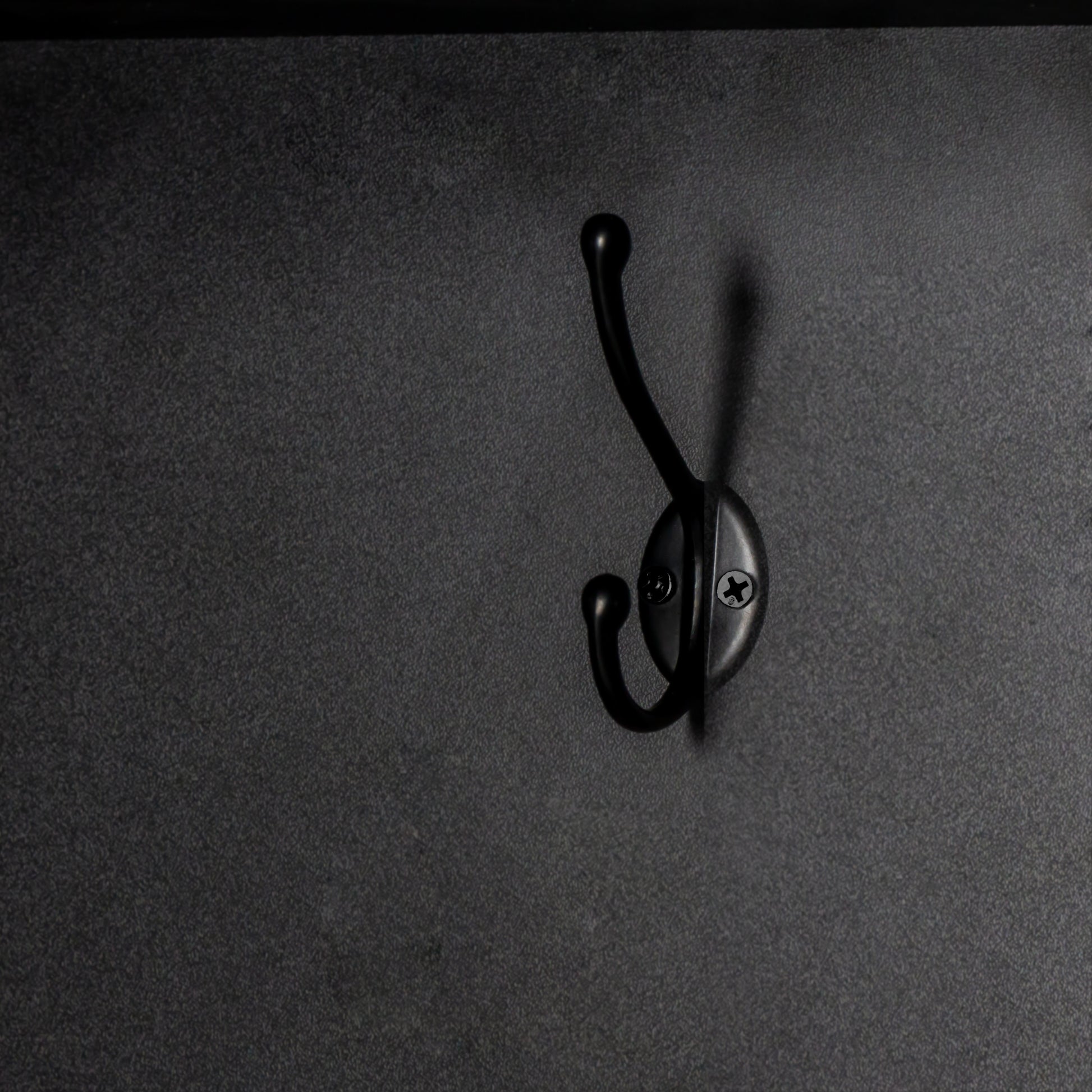 Black metal double hook for hanging coats