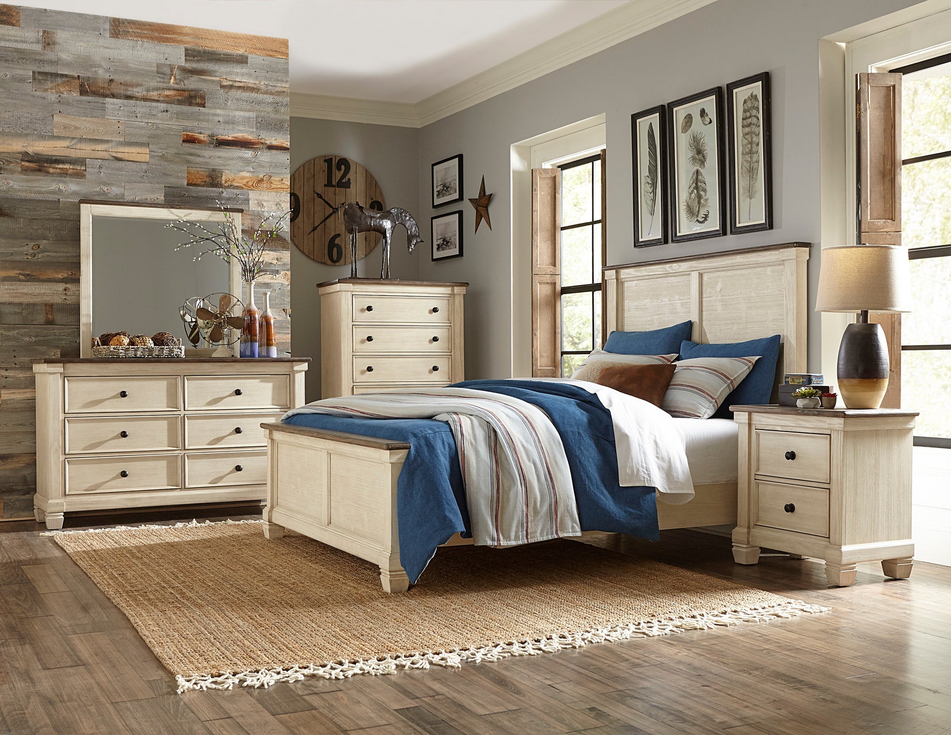 Cream distressed wood panel bed frame with blue bedding and striped pillows