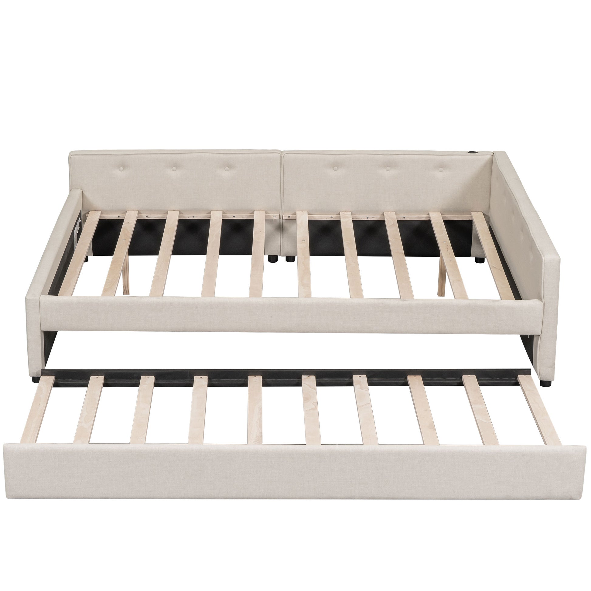 Beige upholstered daybed with pullout trundle tufted back and slatted wood support
