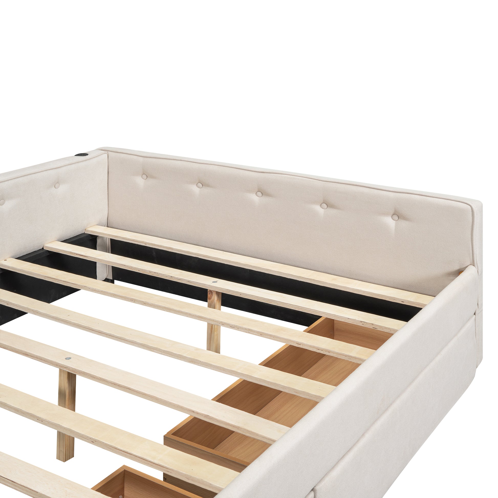 Closeup of upholstered beige bed frame with button tufting and wooden slat support