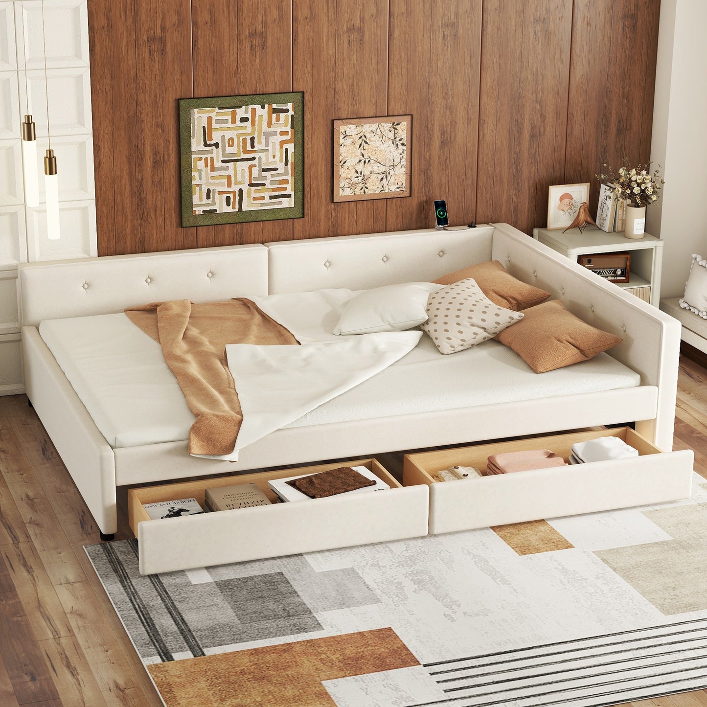 Cream upholstered sofa daybed with tufted accents and pullout drawers