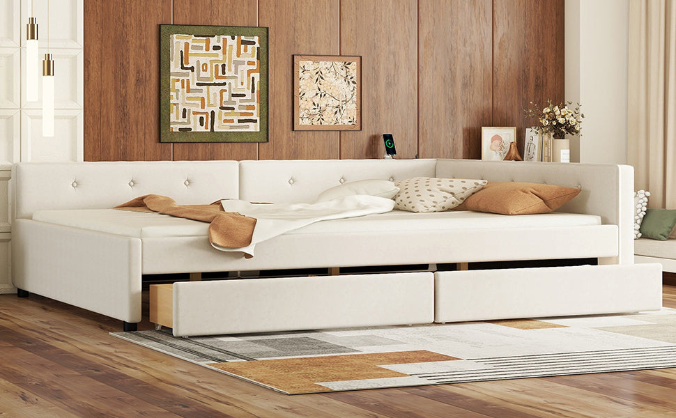 White upholstered sectional daybed with tufted backrests and pullout storage drawers