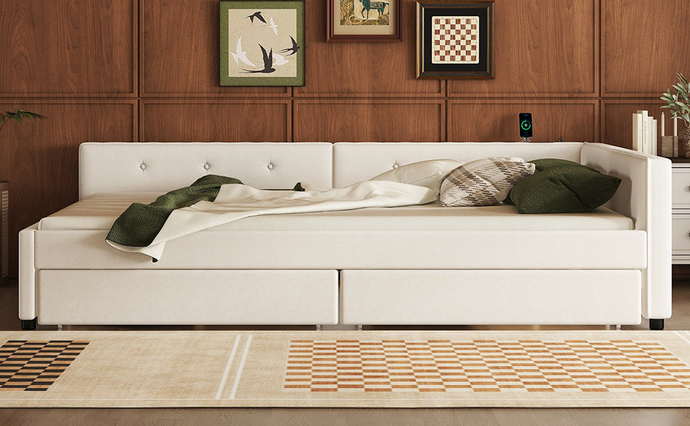 White tufted daybed with storage drawers and plush pillows