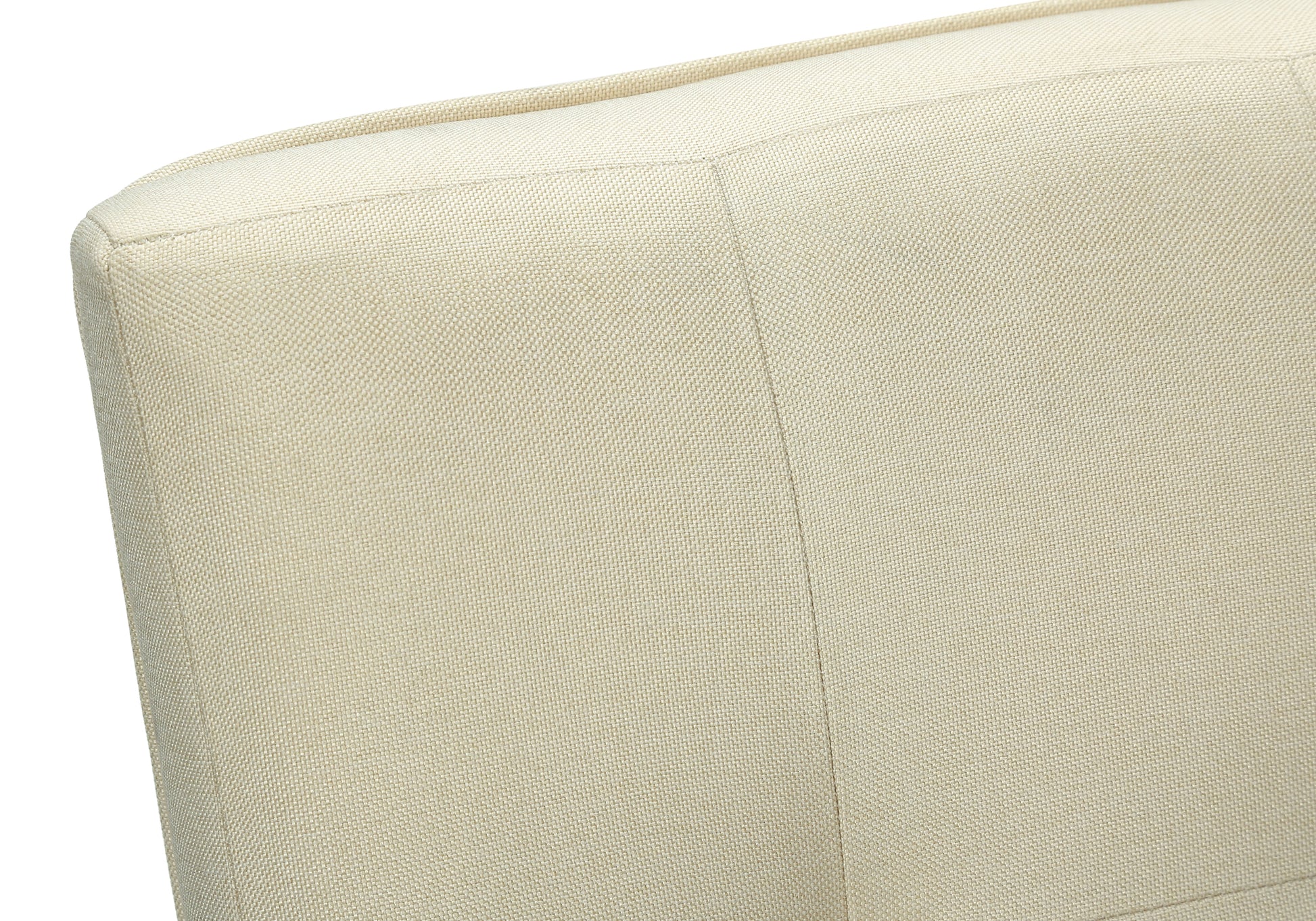 Textured cream fabric upholstery detail on modern armchair
