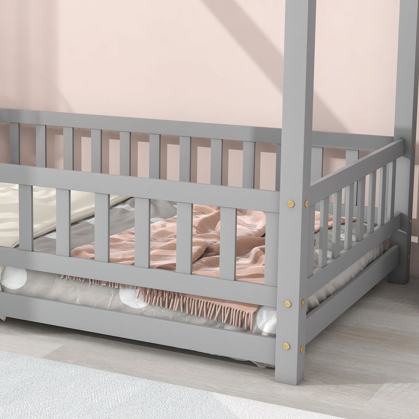 Grey wooden canopy bed frame with white bedding and pink throw blanket