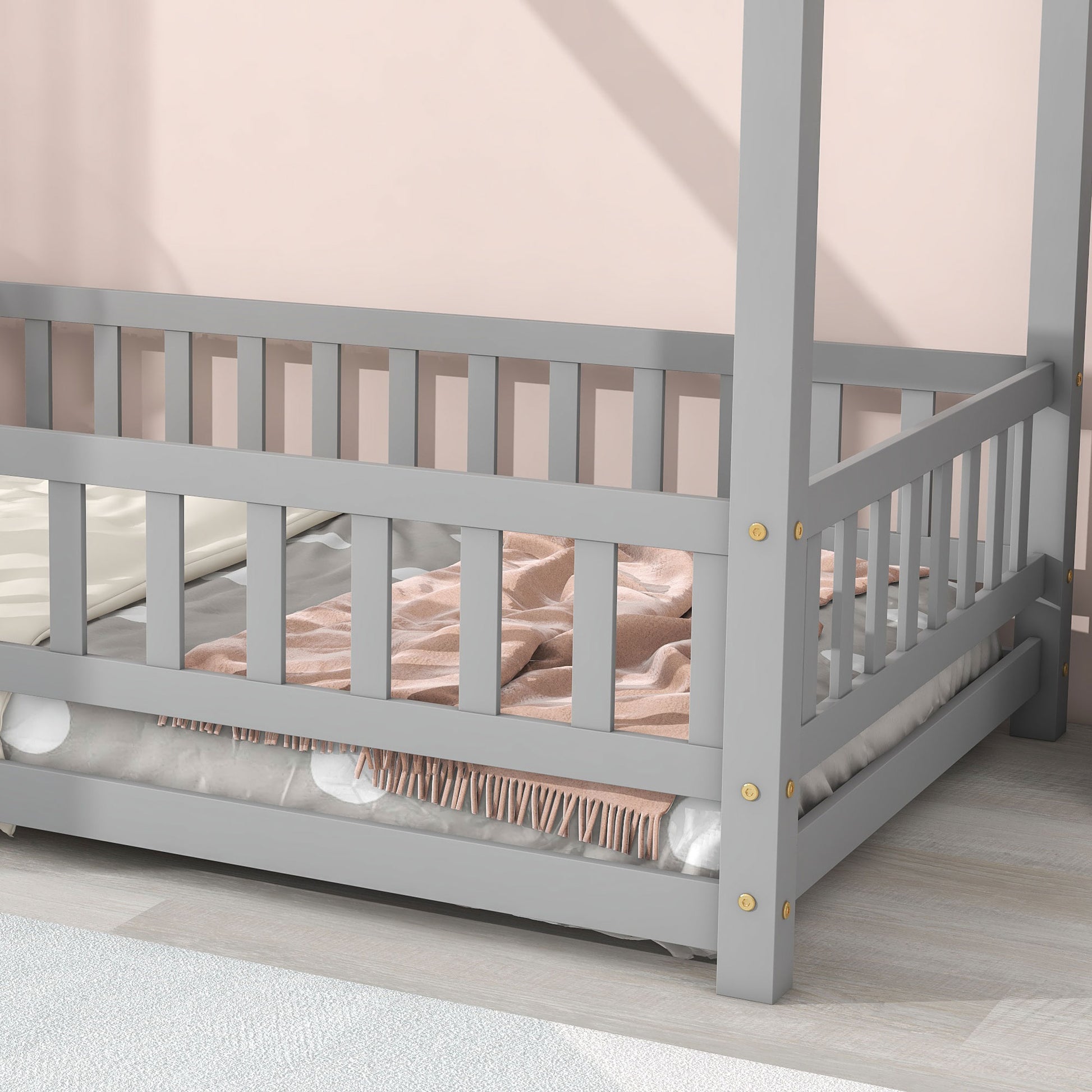 Grey wooden canopy bed frame with white bedding and pink throw blanket