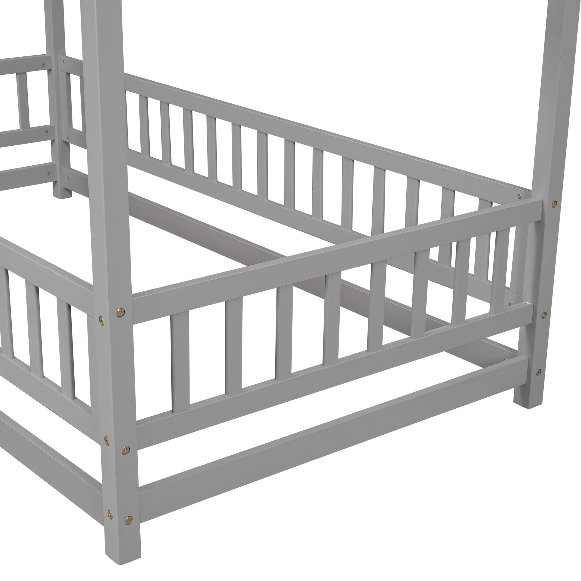 Gray wooden crib with safety rails