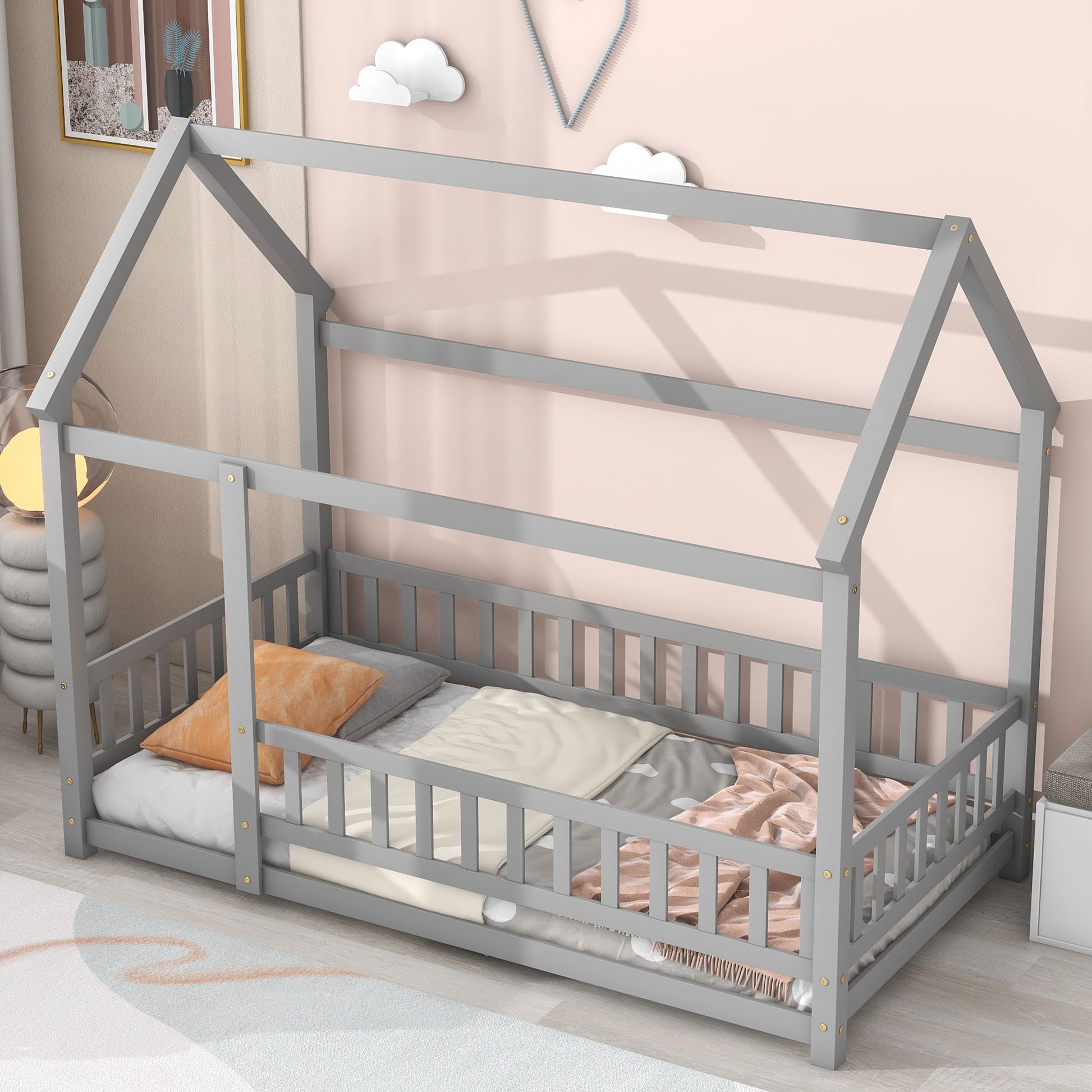 Gray wooden house bed frame with safety rails and bedding