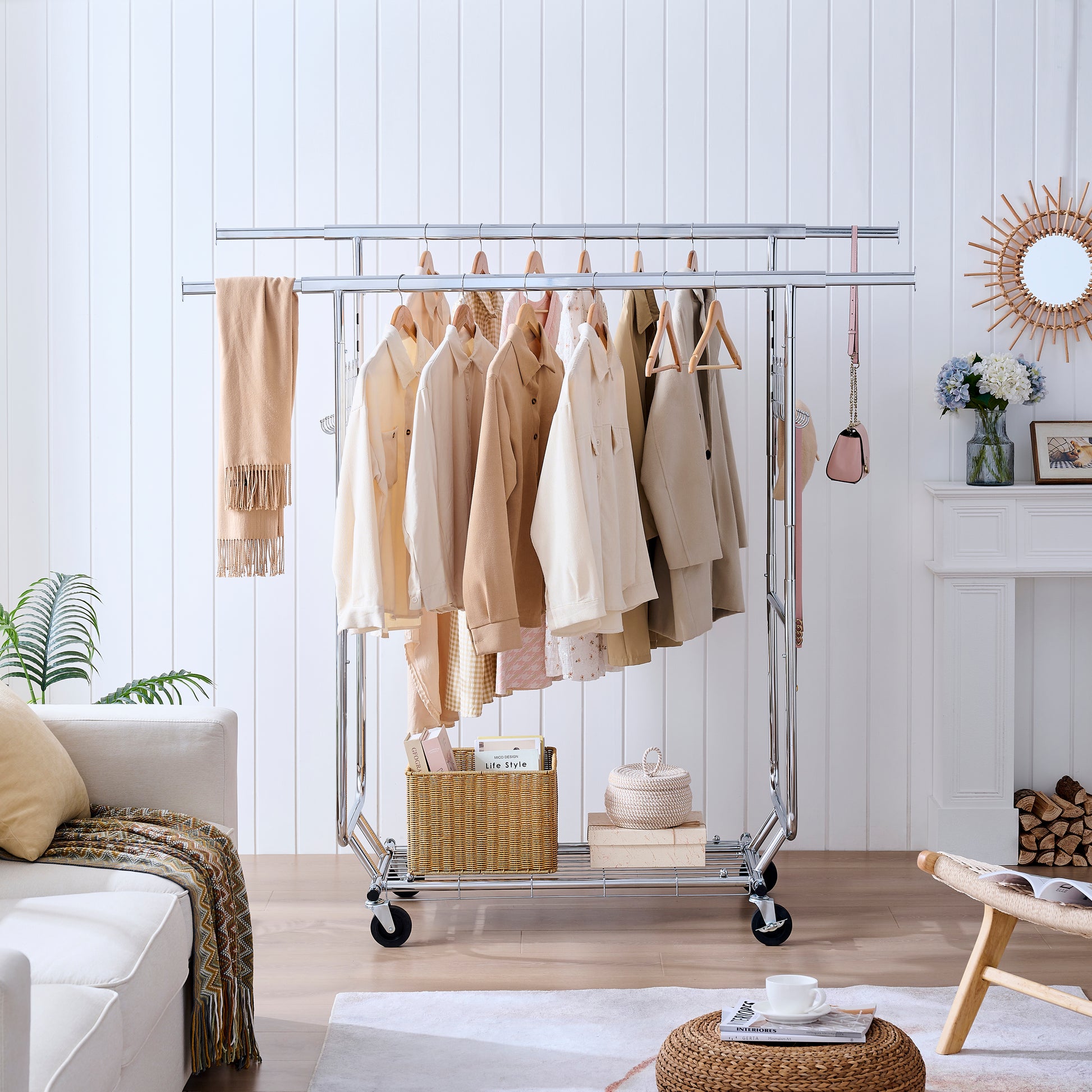 Doubletiered rolling garment rack with assorted neutraltoned jackets and shirts