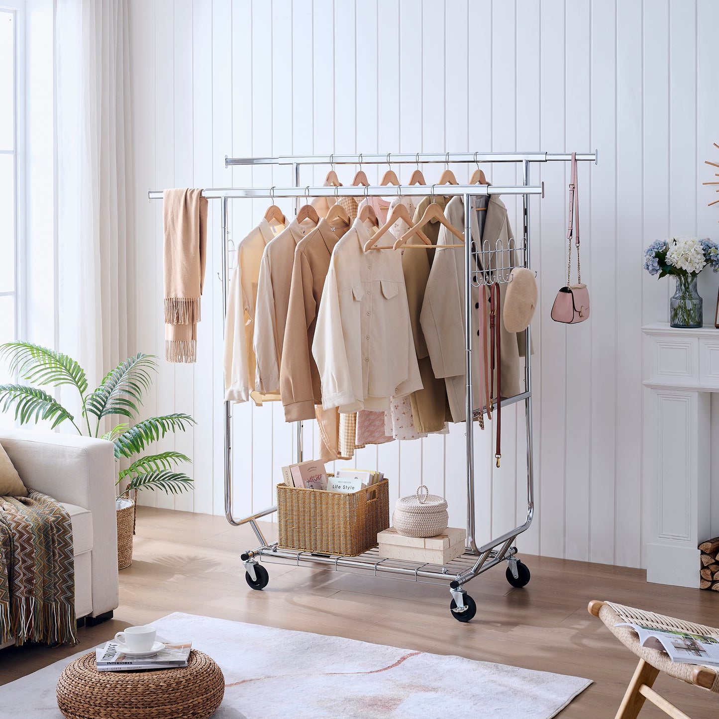 Modern chrome garment rack with wheels displaying neutraltoned shirts and accessories