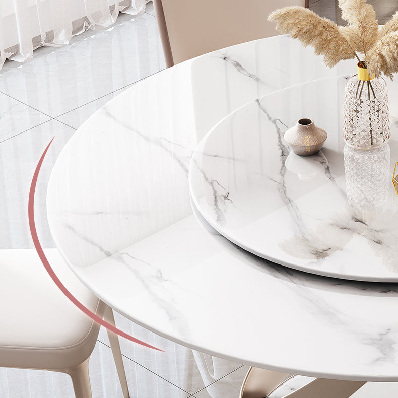 White marble dining table with a revolving tray and decorative vase
