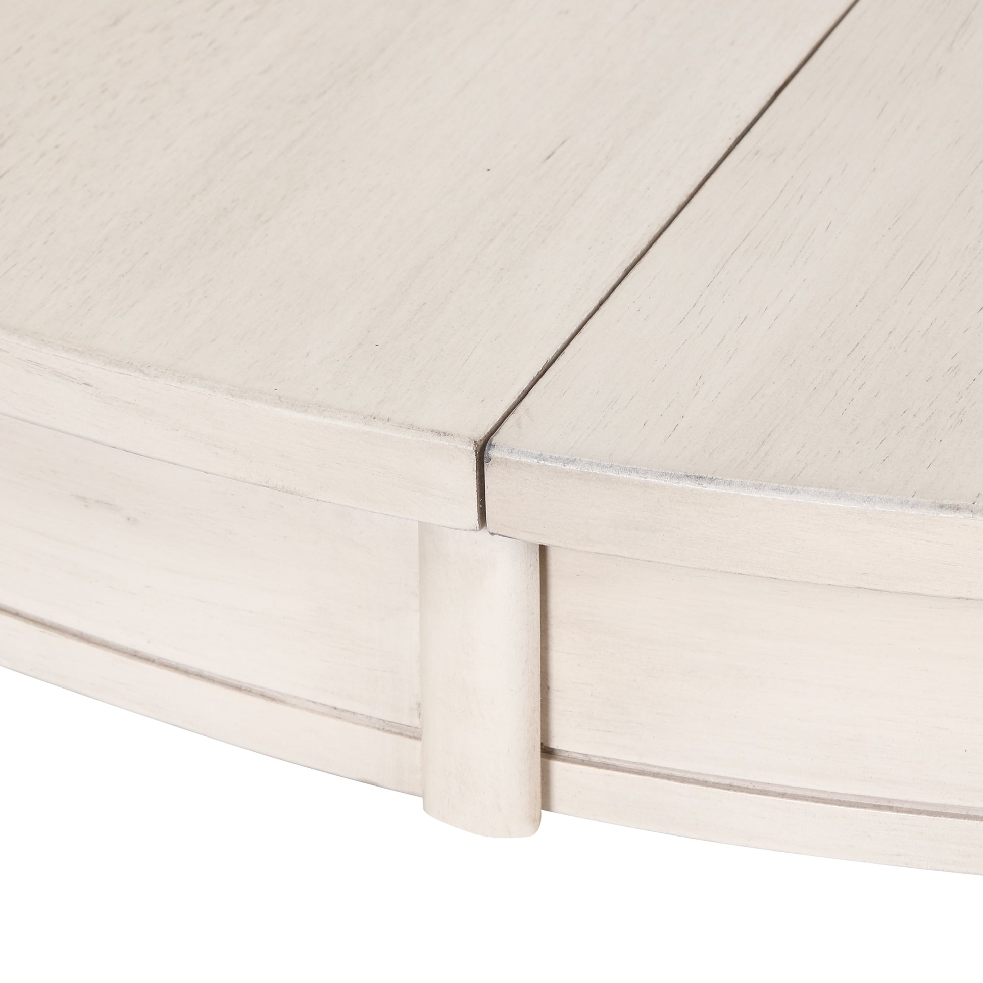 Closeup of distressed white painted wooden table edge with visible grain