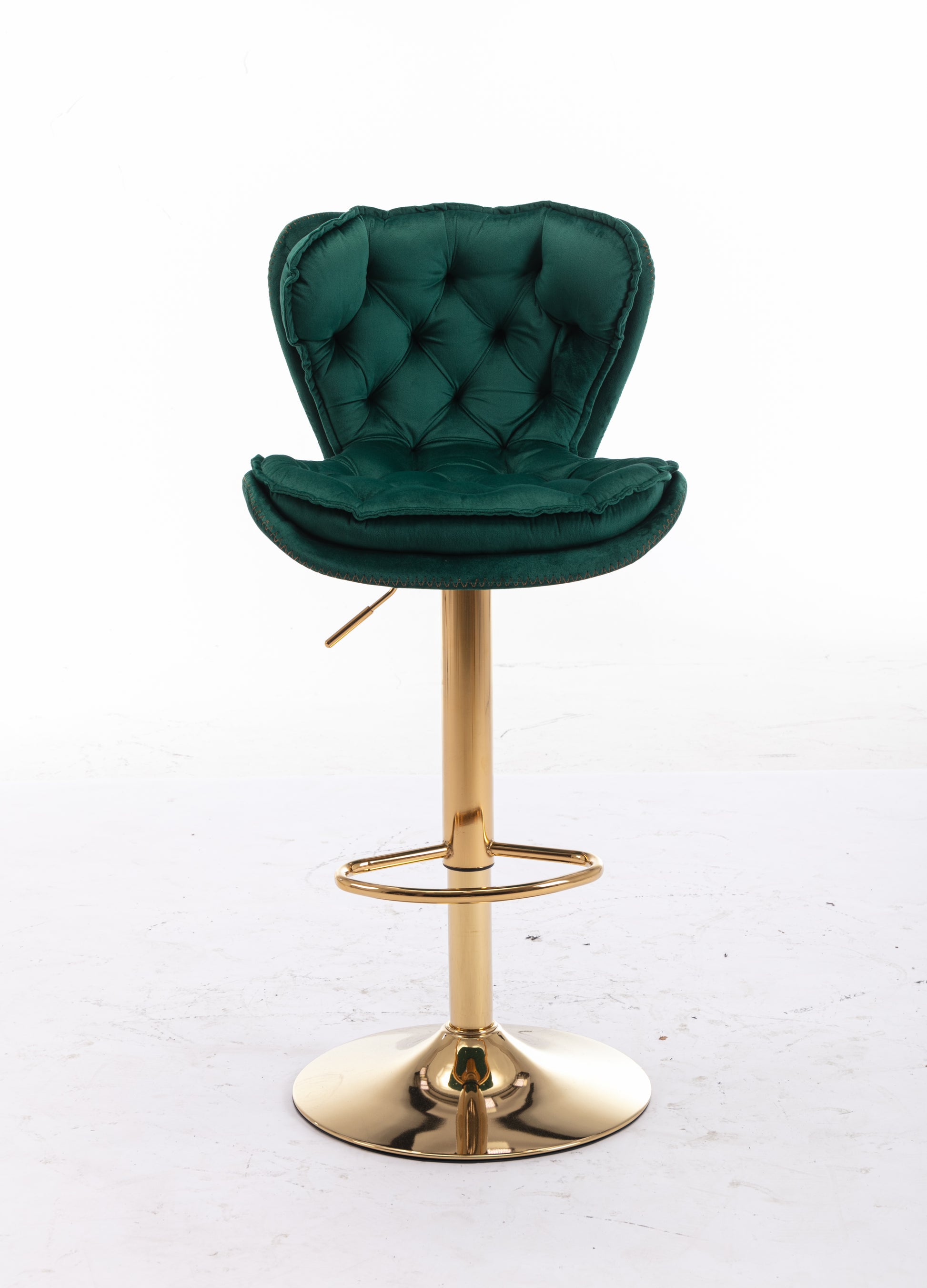 Emerald green velvet tufted bar stool with adjustable gold base