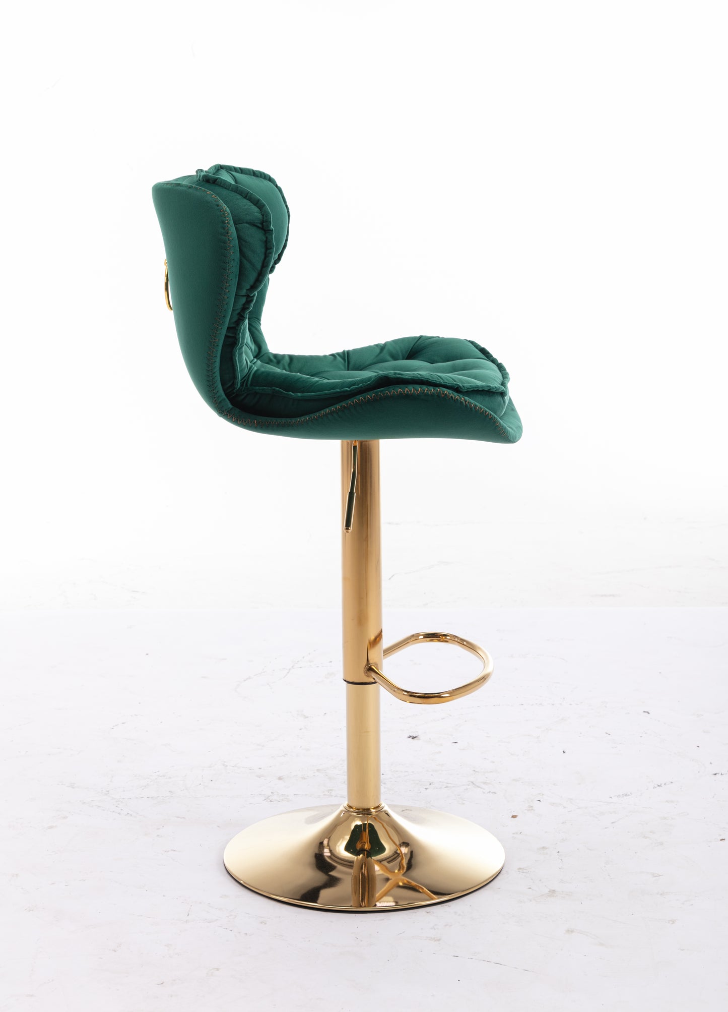 Emerald green velvet bar stool with tufted back and gold base