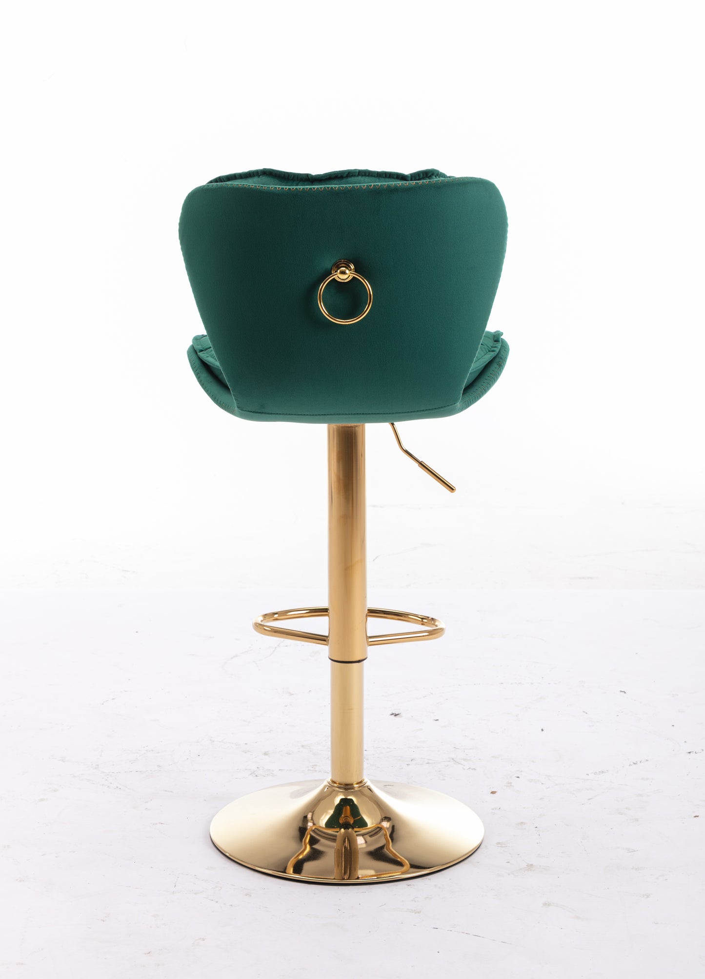 Emerald green velvet bar stool with gold ring detail and polished gold base
