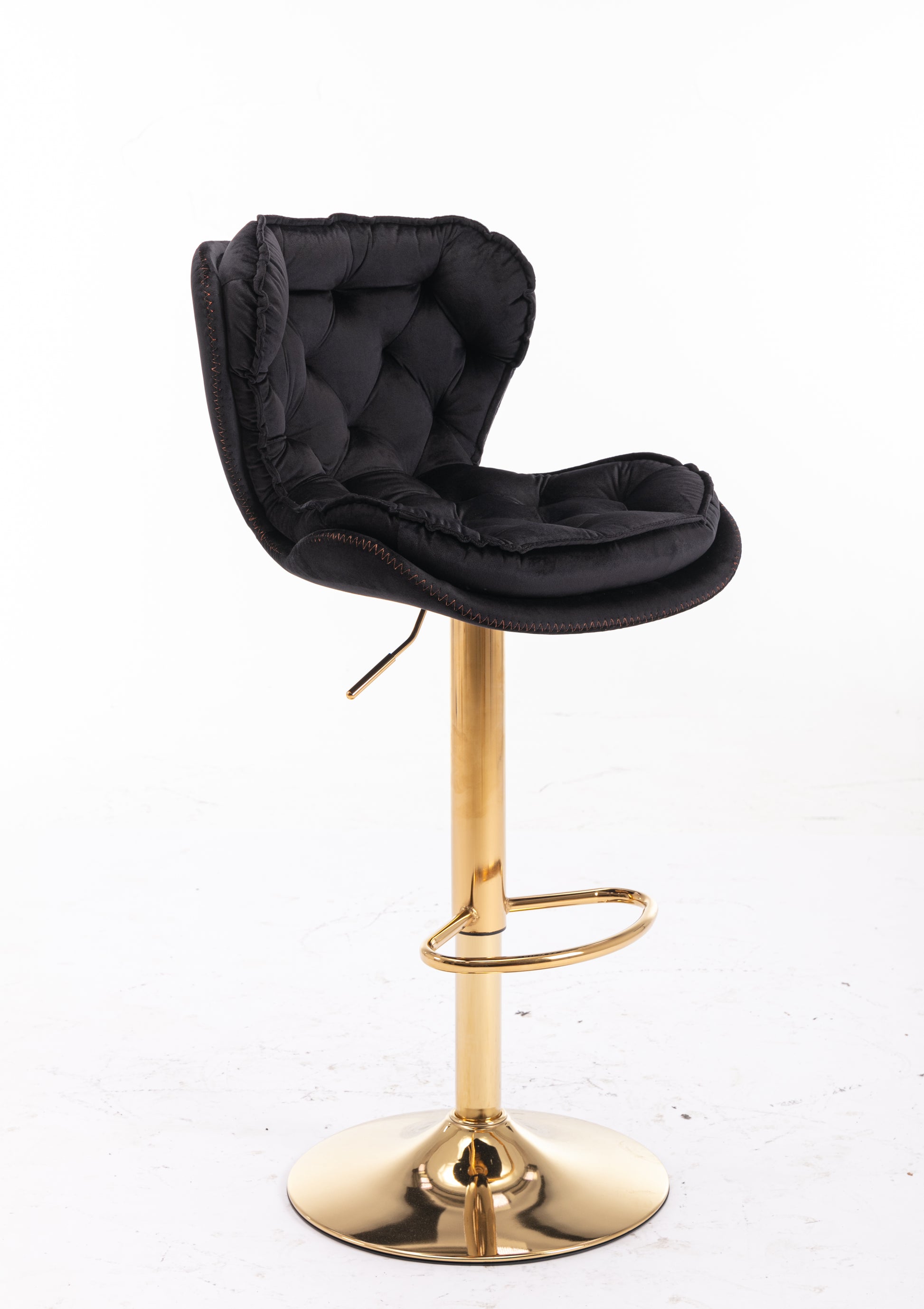 Black velvet bar stool with tufted back and gold base