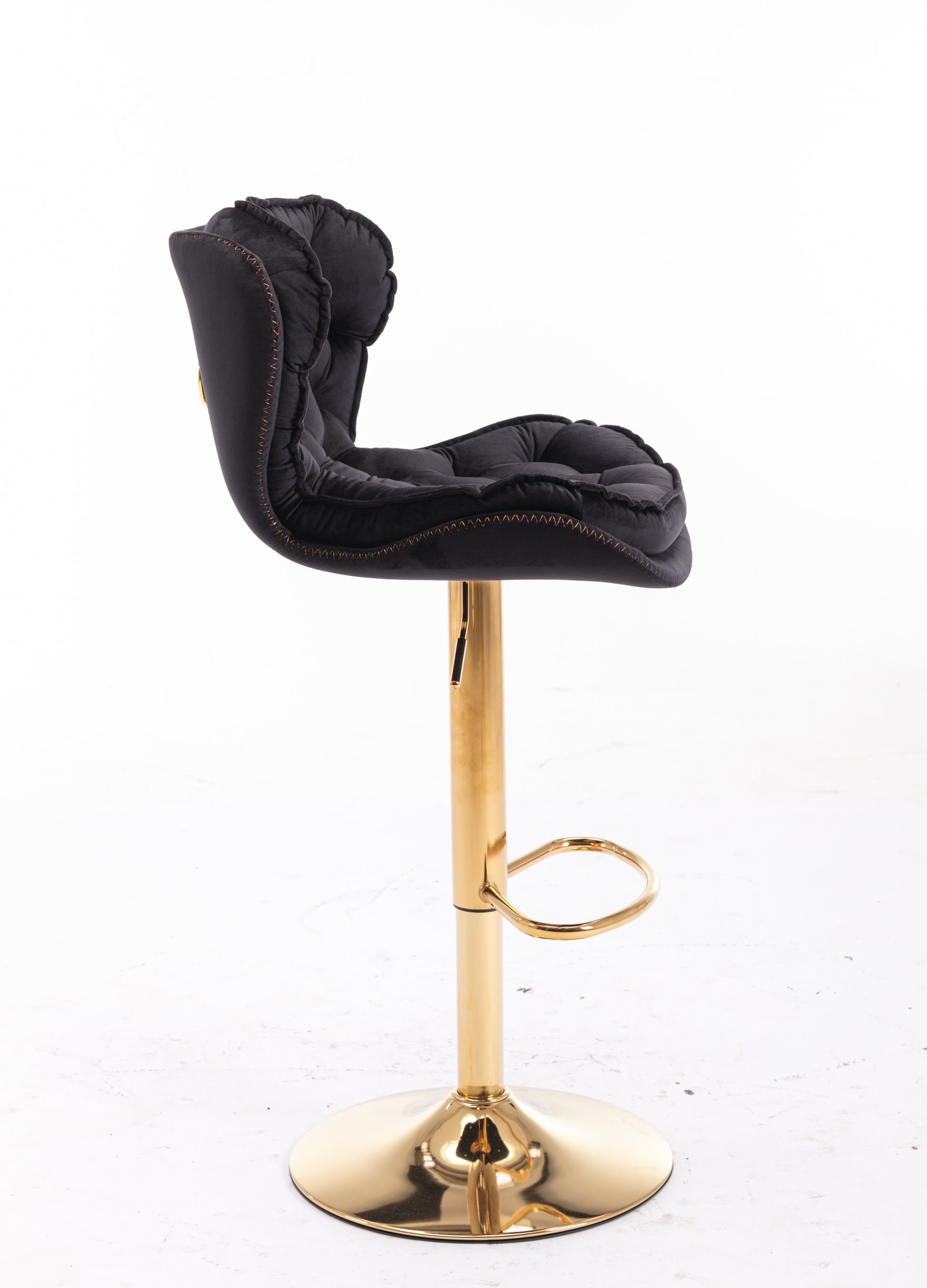 Black velvet tufted bar stool with gold adjustable base and footrest
