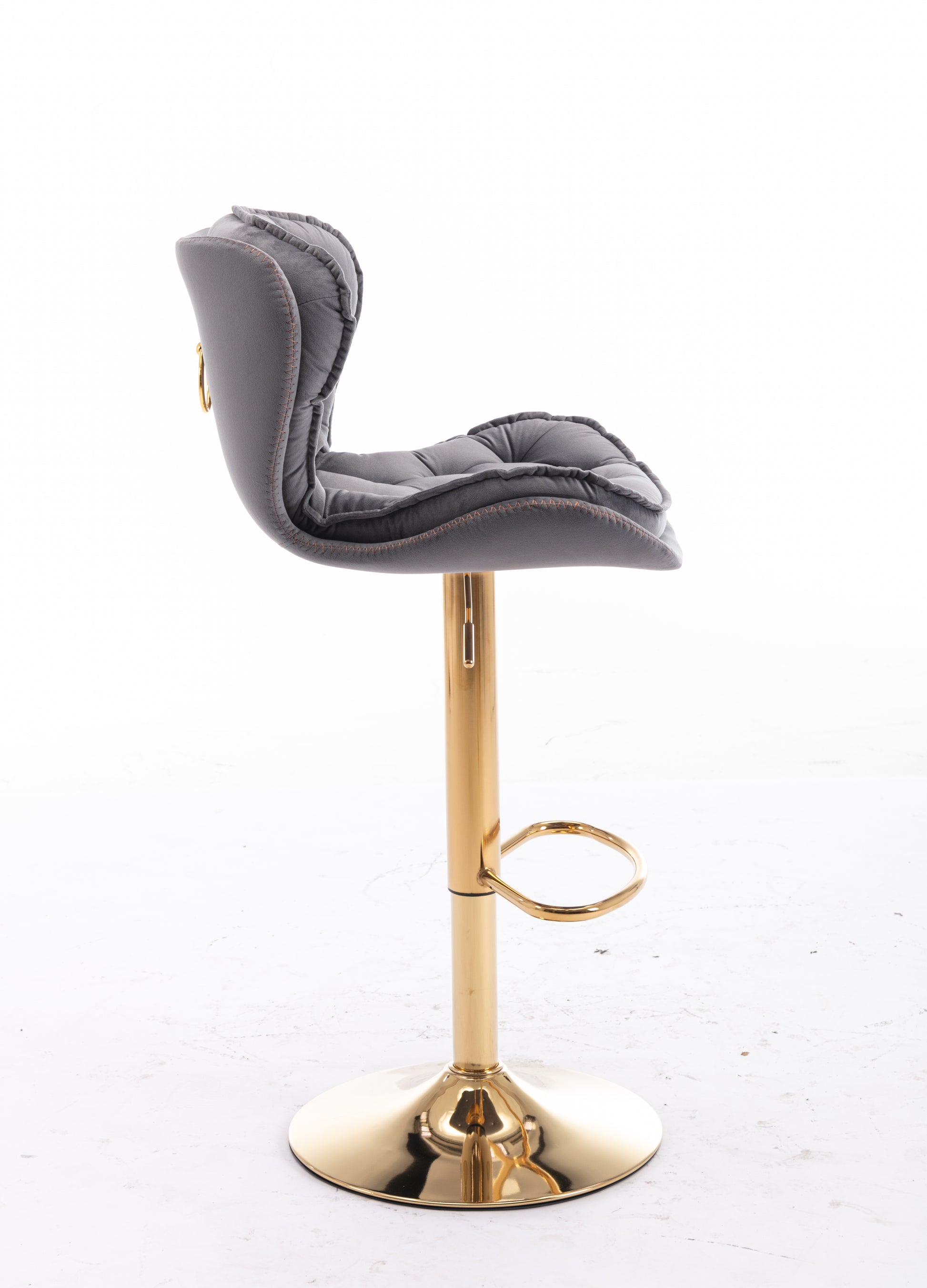 Padded grey bar stool with tufted seat and golden base