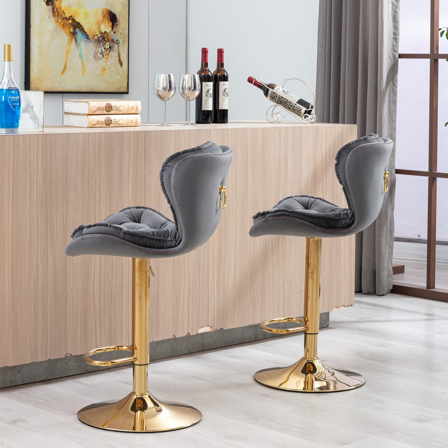 Grey velvet bar stool with gold accents and adjustable height