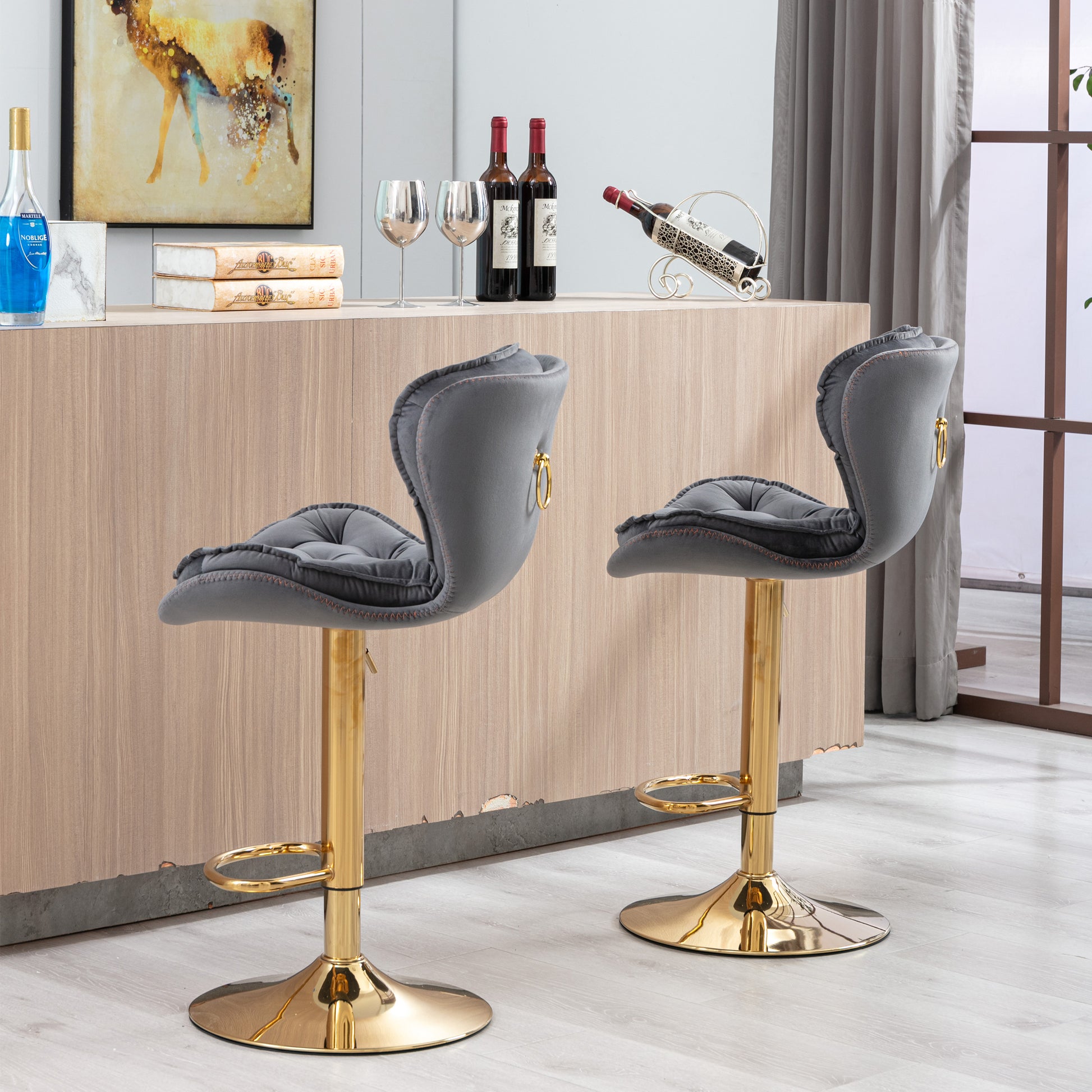 Grey velvet bar stool with gold accents and adjustable height