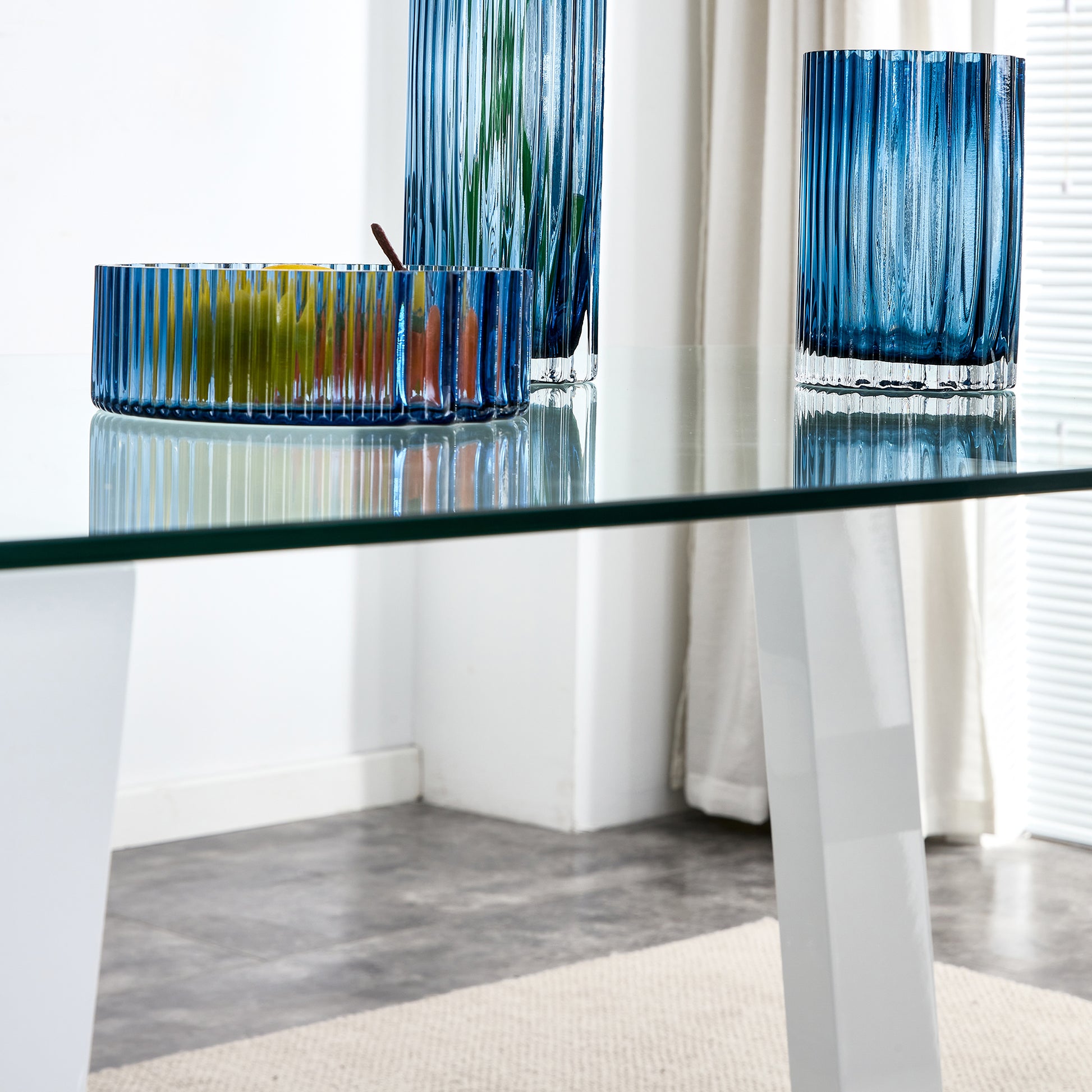 Blue fluted glass fruit bowl with pears and lemons