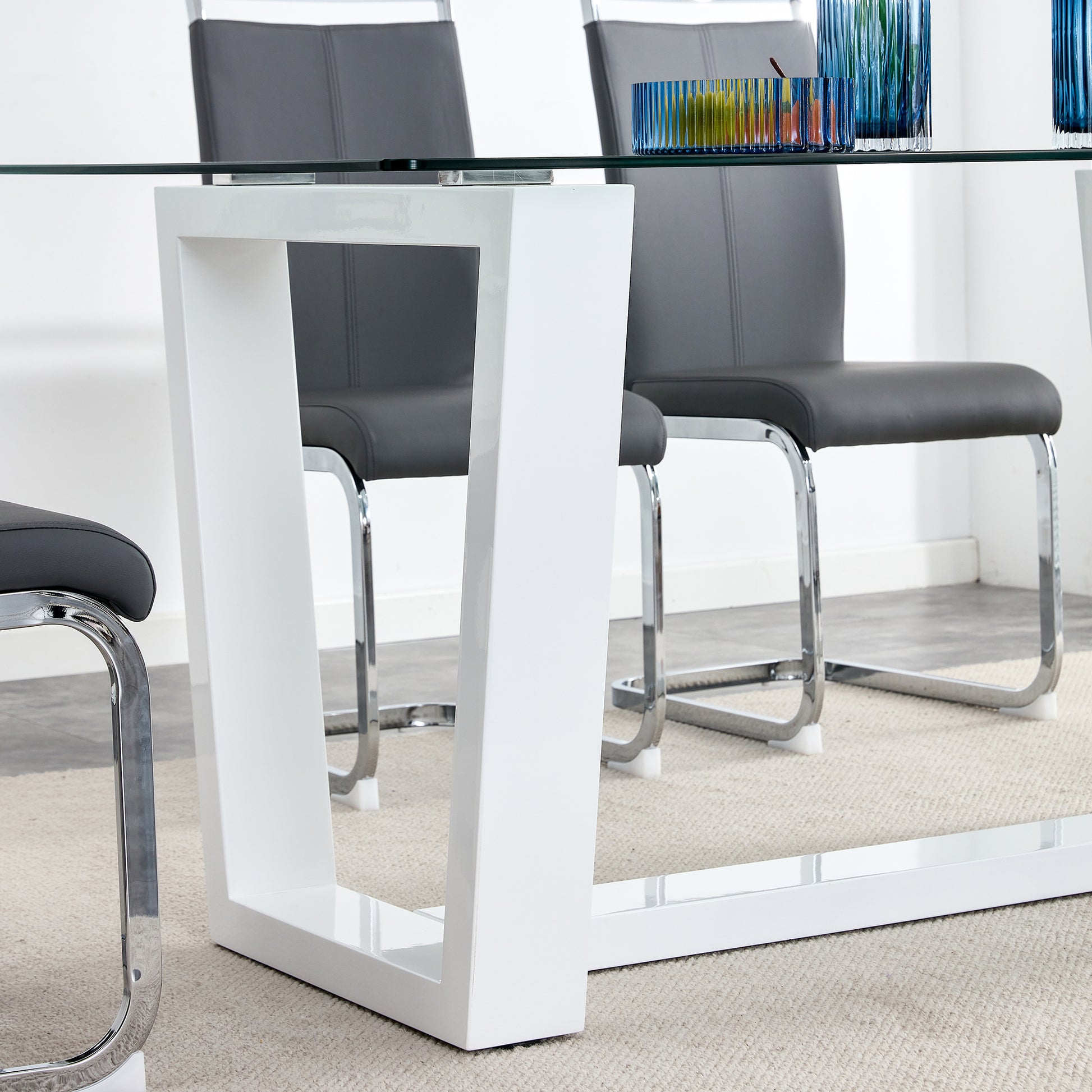Modern white gloss dining table with chrome legs
