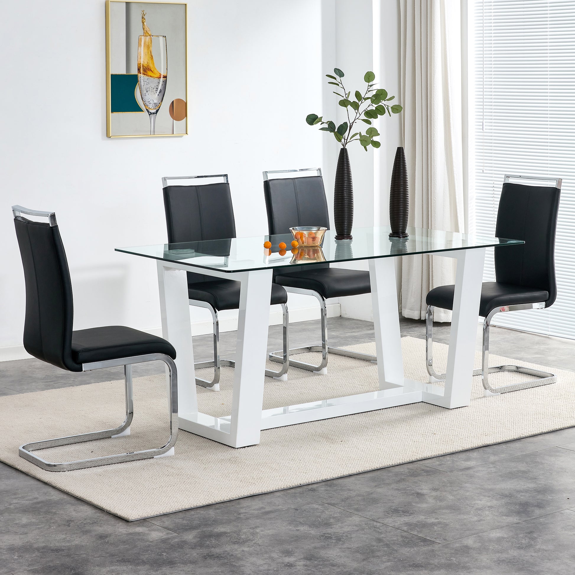 Modern glass top dining table with four black leather chairs
