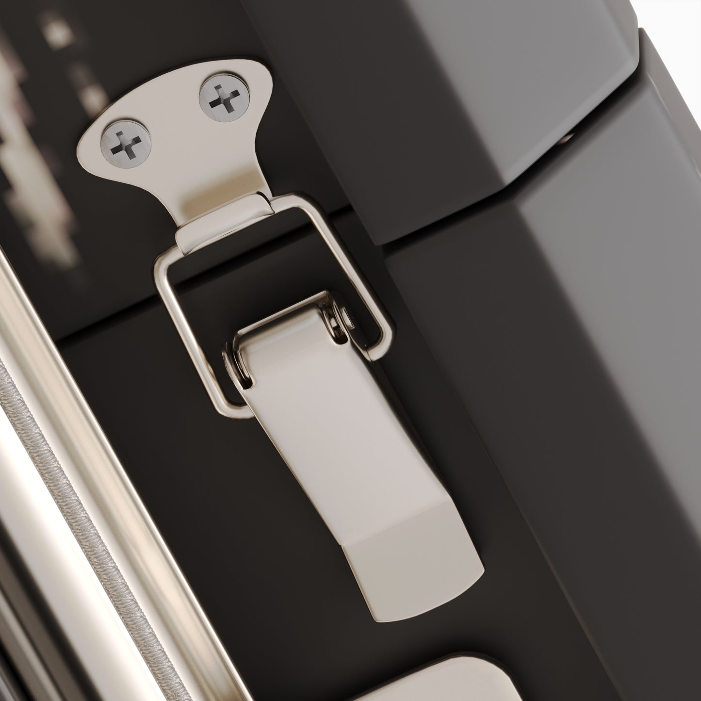 Sleek silver latch on a black travel case