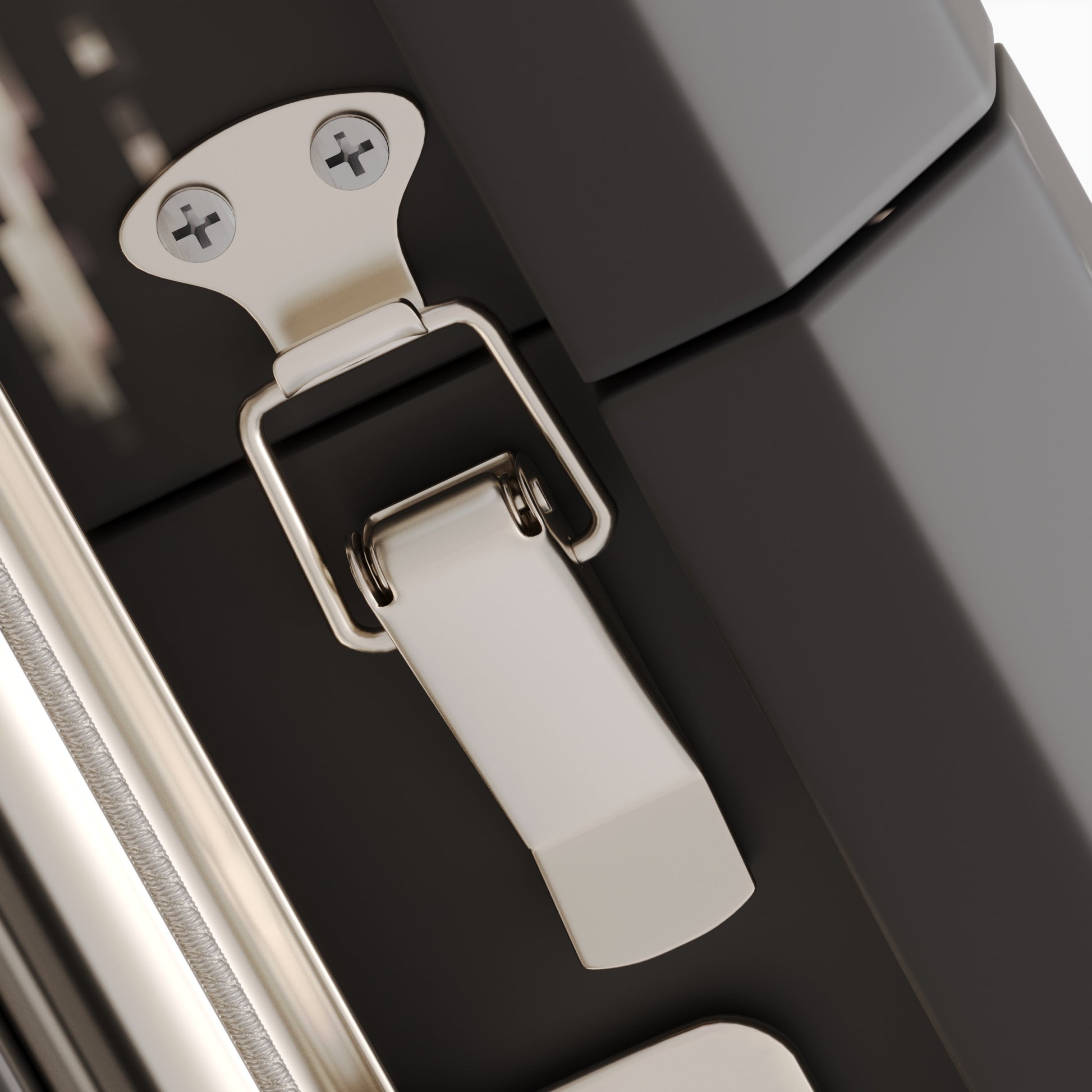 Sleek silver latch on a black travel case