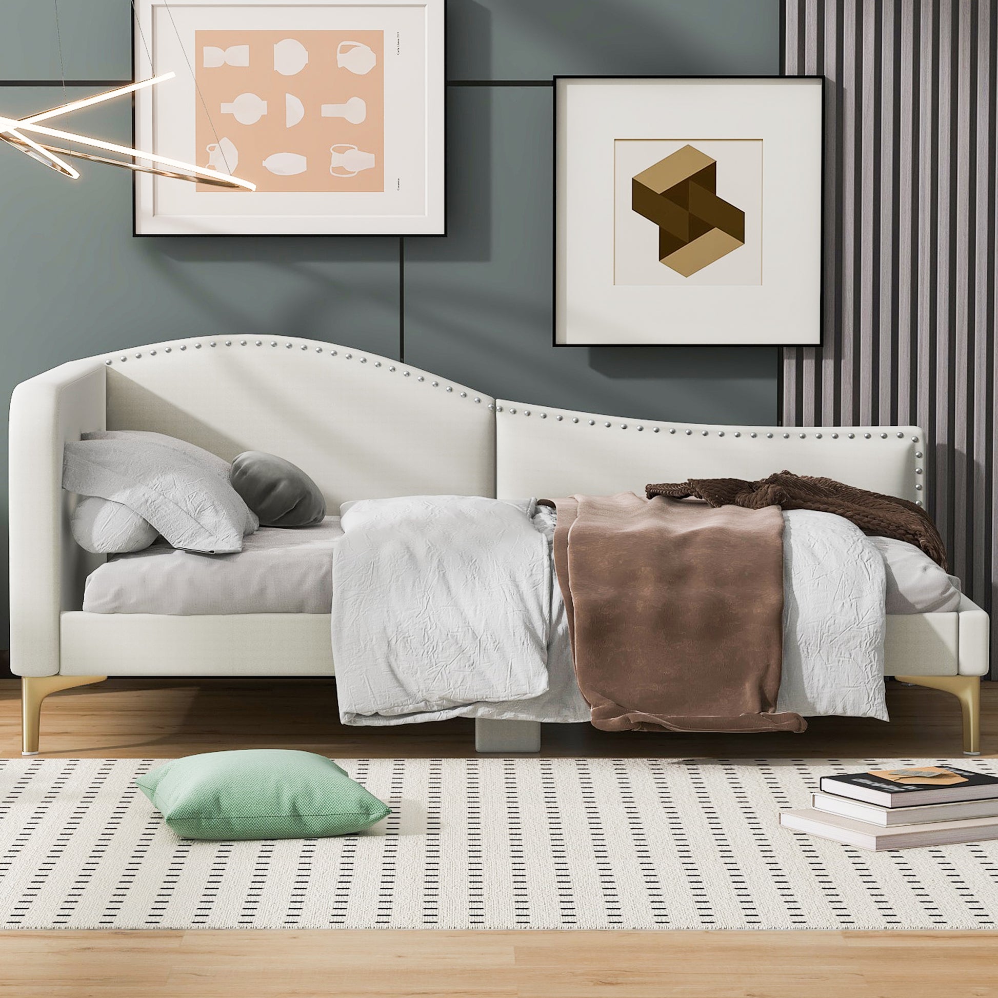 White velvet daybed with silver nailhead trim and gold legs