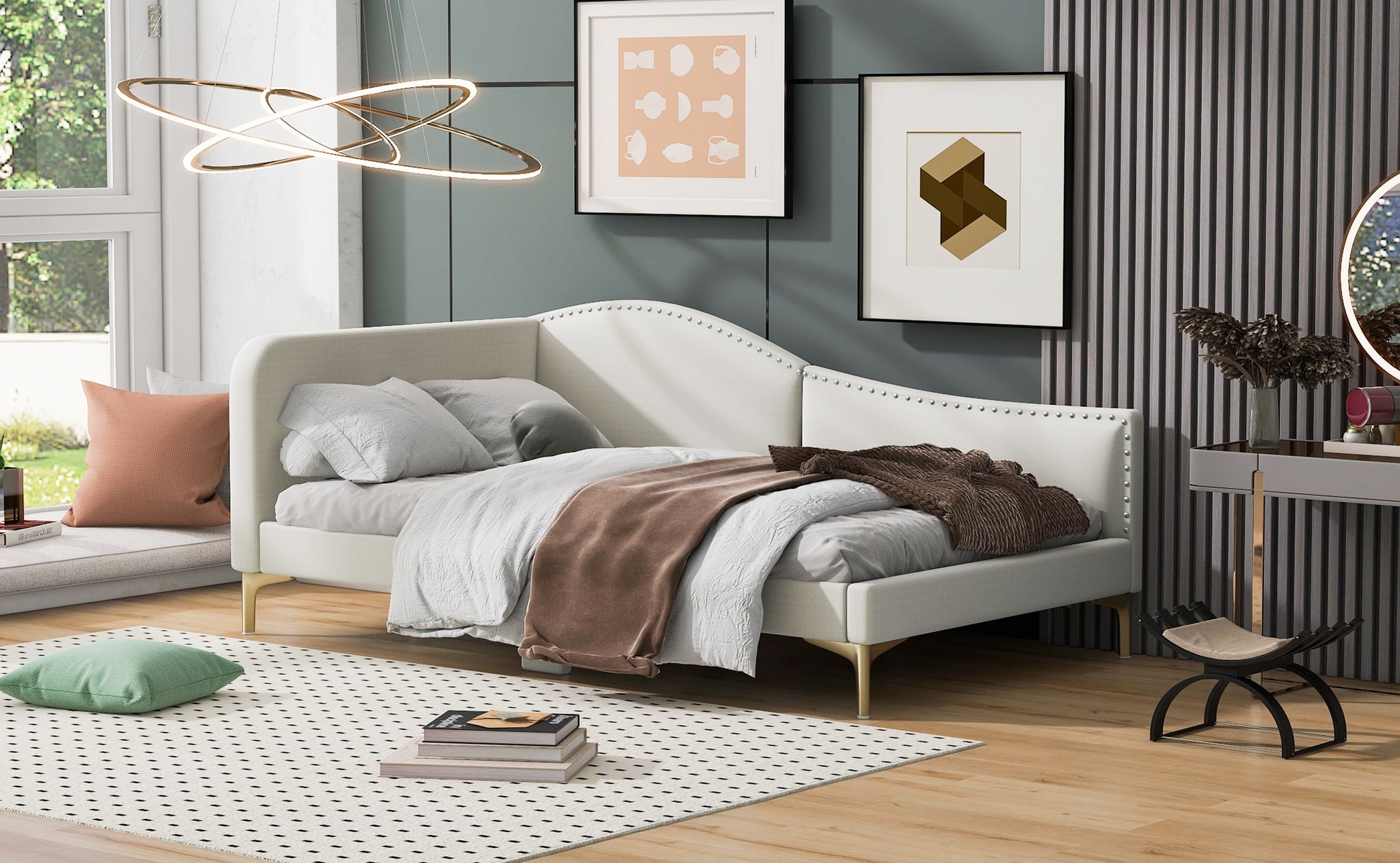 White upholstered chaise lounge with gold legs and studded headrest