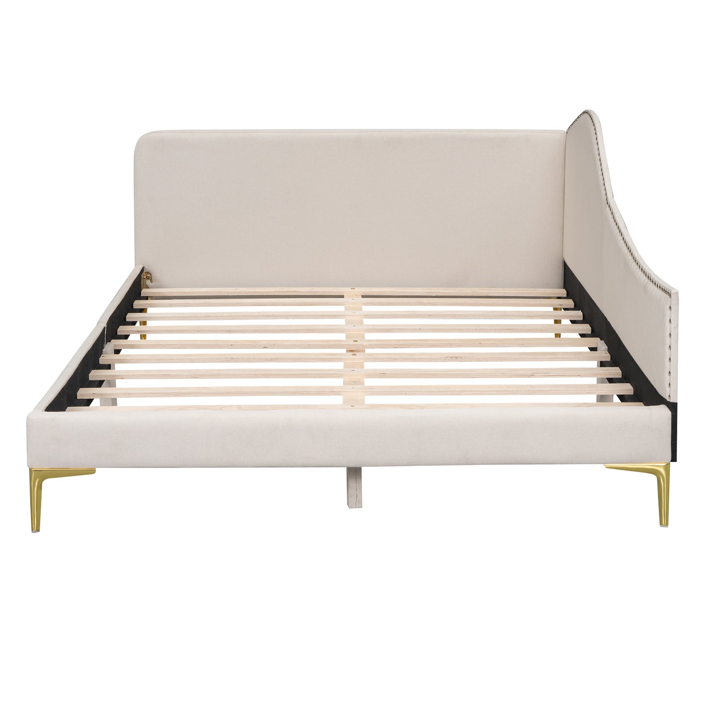 Cream upholstered platform bed with gold legs and nailhead trim