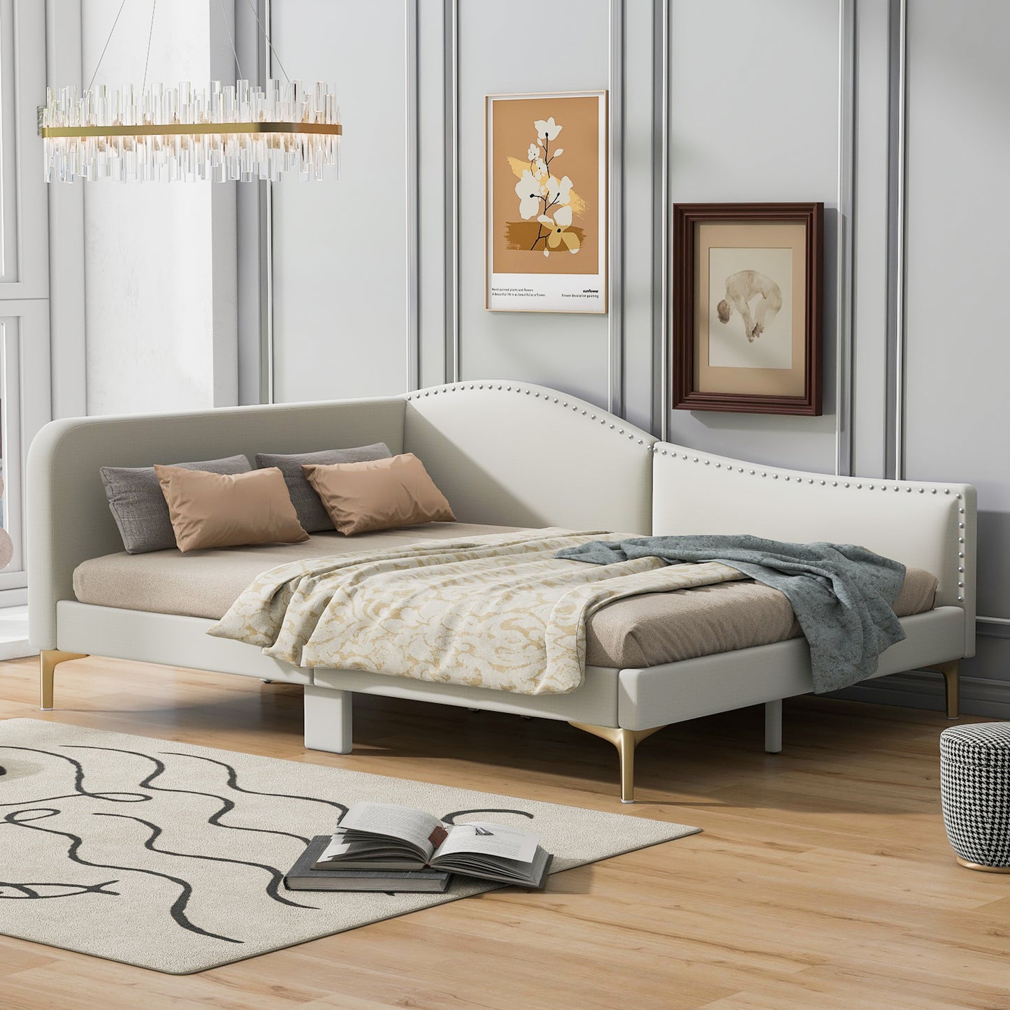 Modern white daybed with gold legs and studded trim