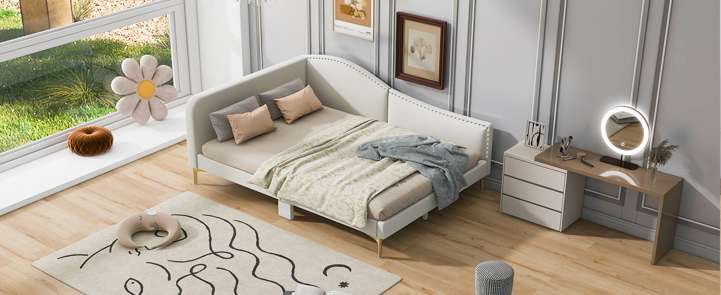 White velvet upholstered twin bed with gold legs and nailhead trim
