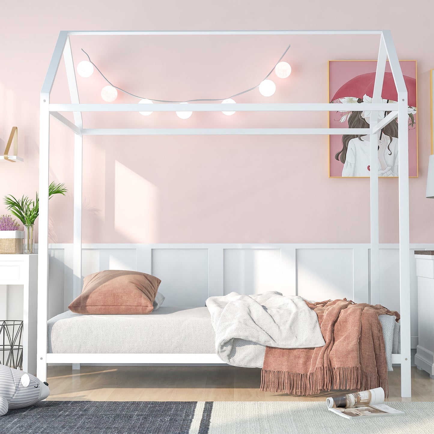 White metal house bed frame with string lights