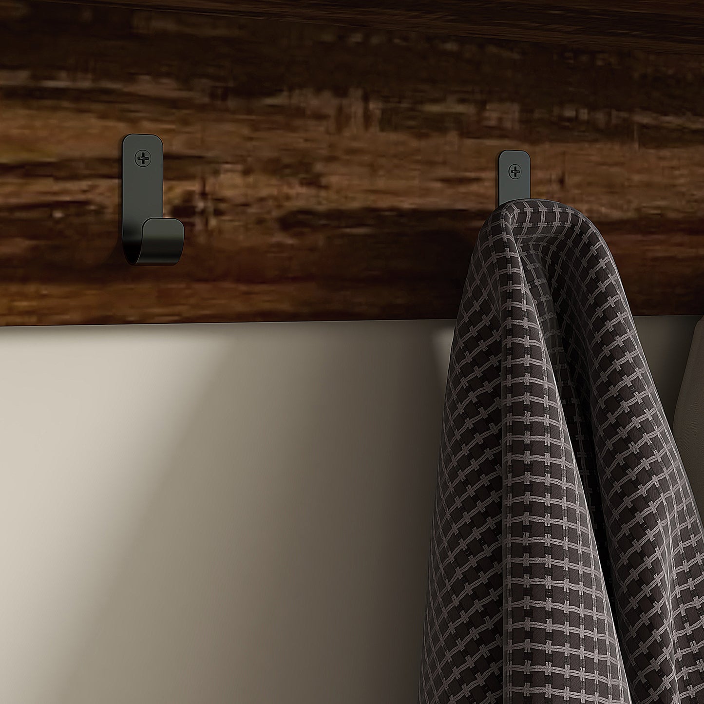 Black metal wall hook with farmhouse style on dark wood