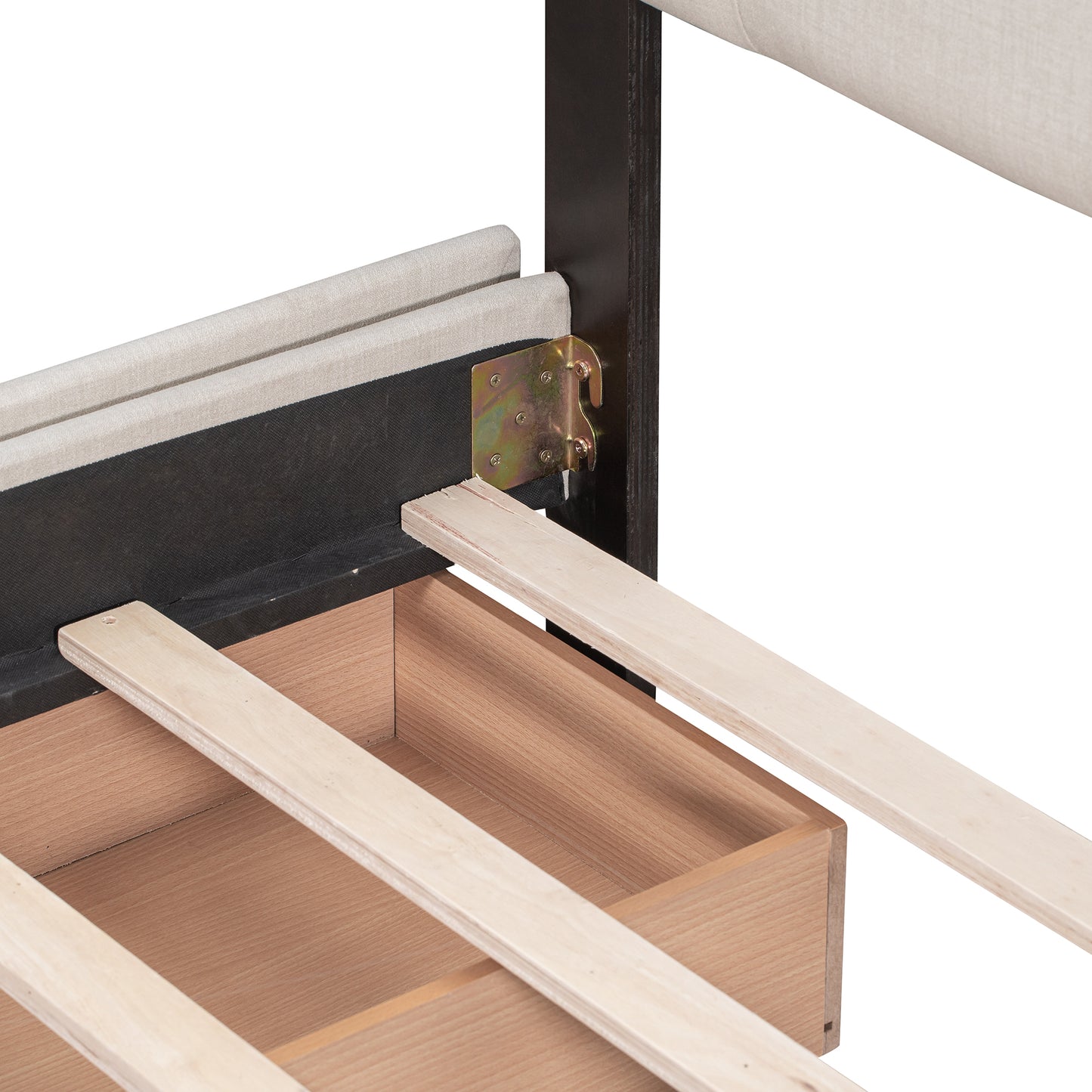 Closeup of upholstered bed frame with visible wood slats and drawer support