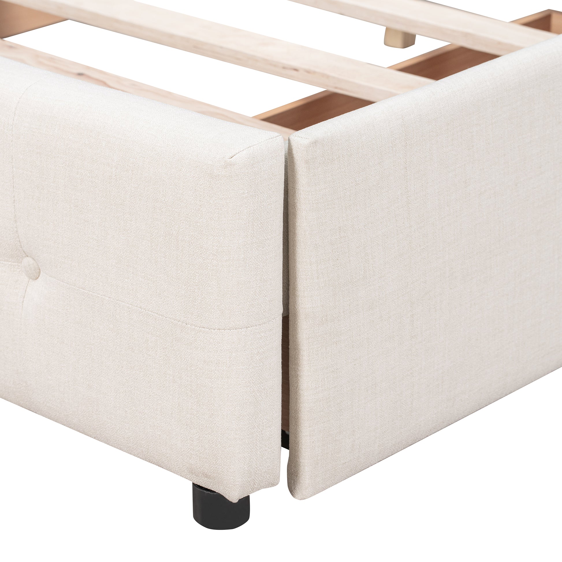 Cream upholstered bed frame detail with wooden slats