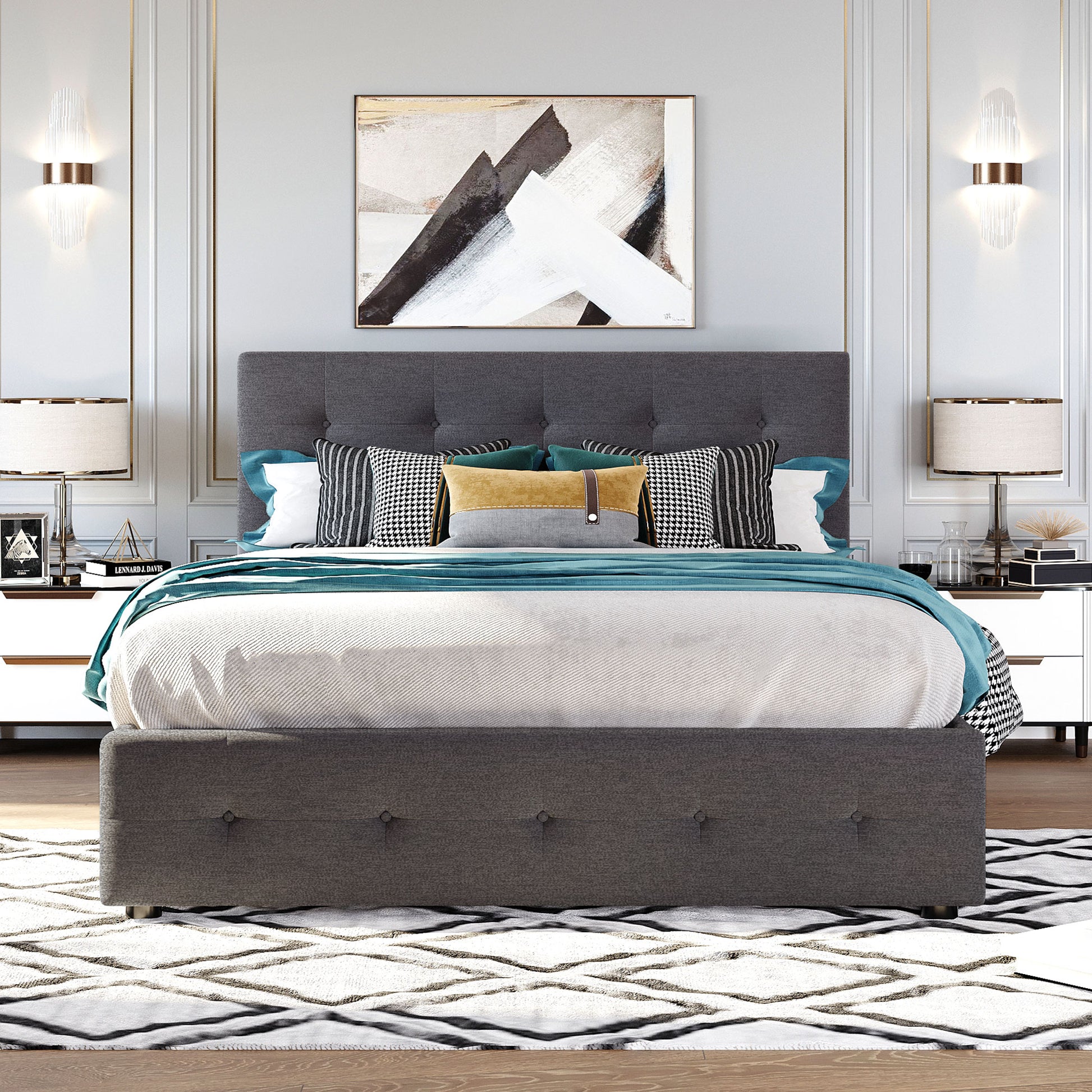 Dark grey tufted upholstered queen bed with teal throw and patterned pillows